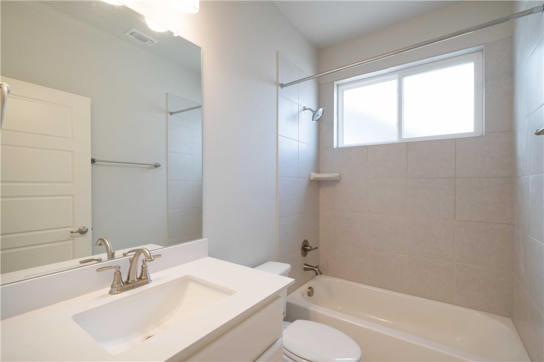 9124 Cattle Baron Path Austin, TX 78747 - Photo 27 of 36 a bathroom with a sink toilet tub and shower