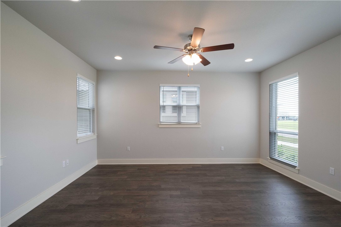9124 Cattle Baron Path Austin, TX 78747 - Photo 5 of 36 a view of a room with wooden floor and windows