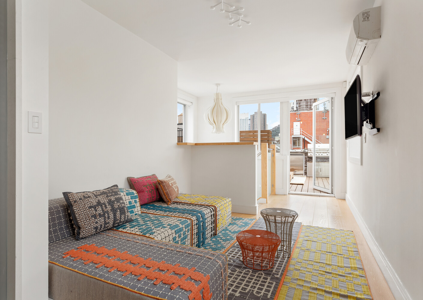 521 West 47th Street, Unit PHD Manhattan, NY 10036 - Photo 11 of 14 a living room with furniture