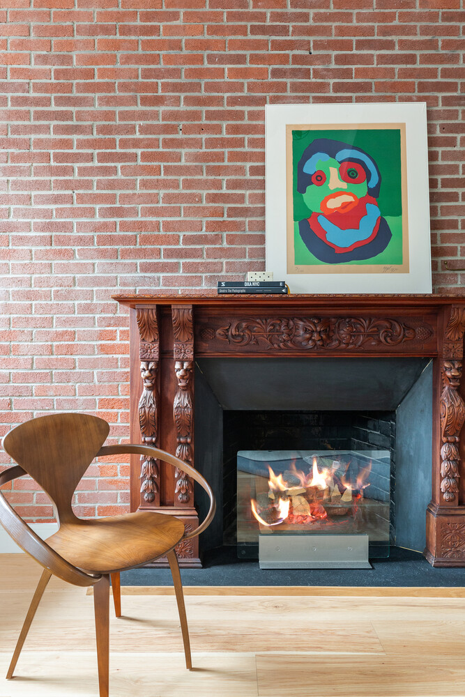 521 West 47th Street, Unit PHD Manhattan, NY 10036 - Photo 3 of 14 a fireplace with an outdoor space