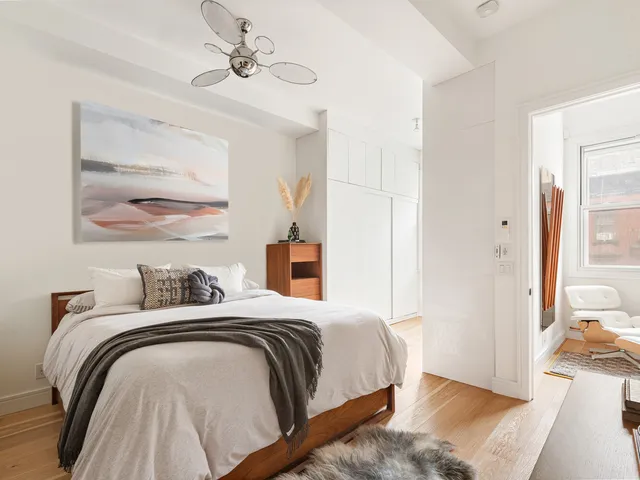 a kitchen with stainless steel appliances granite countertop a stove top oven a sink and a refrigerator