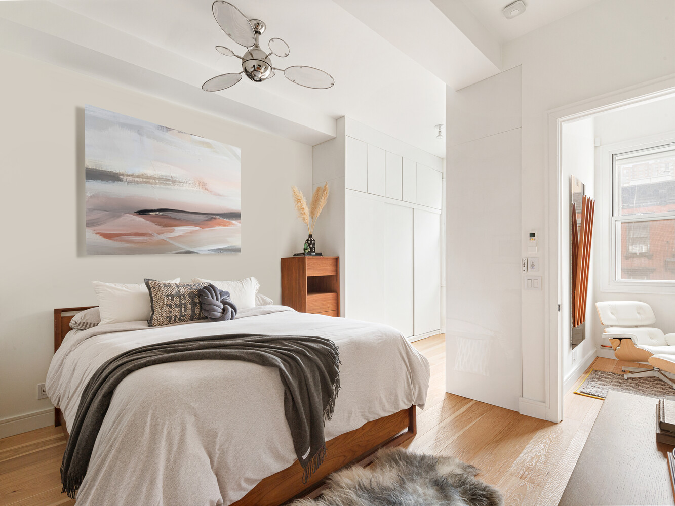 521 West 47th Street, Unit PHD Manhattan, NY 10036 - Photo 5 of 14 a bedroom with a bed and wooden floor