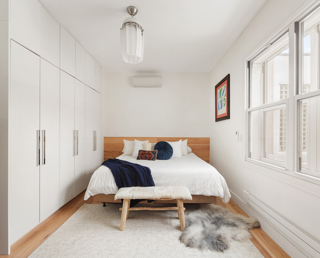 521 West 47th Street, Unit PHD Manhattan, NY 10036 - Photo 8 of 14 a bedroom with a bed and a window