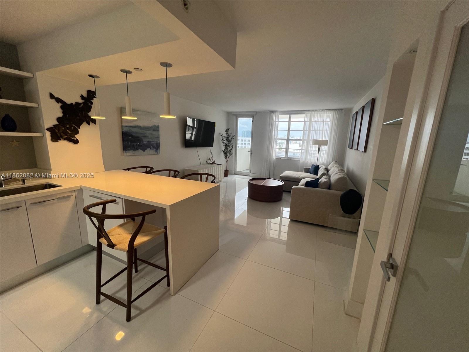 100 Lincoln Road, Unit 1022 Miami Beach, FL 33139 - Photo 19 of 63 a very nice looking dining room with a couch and a window