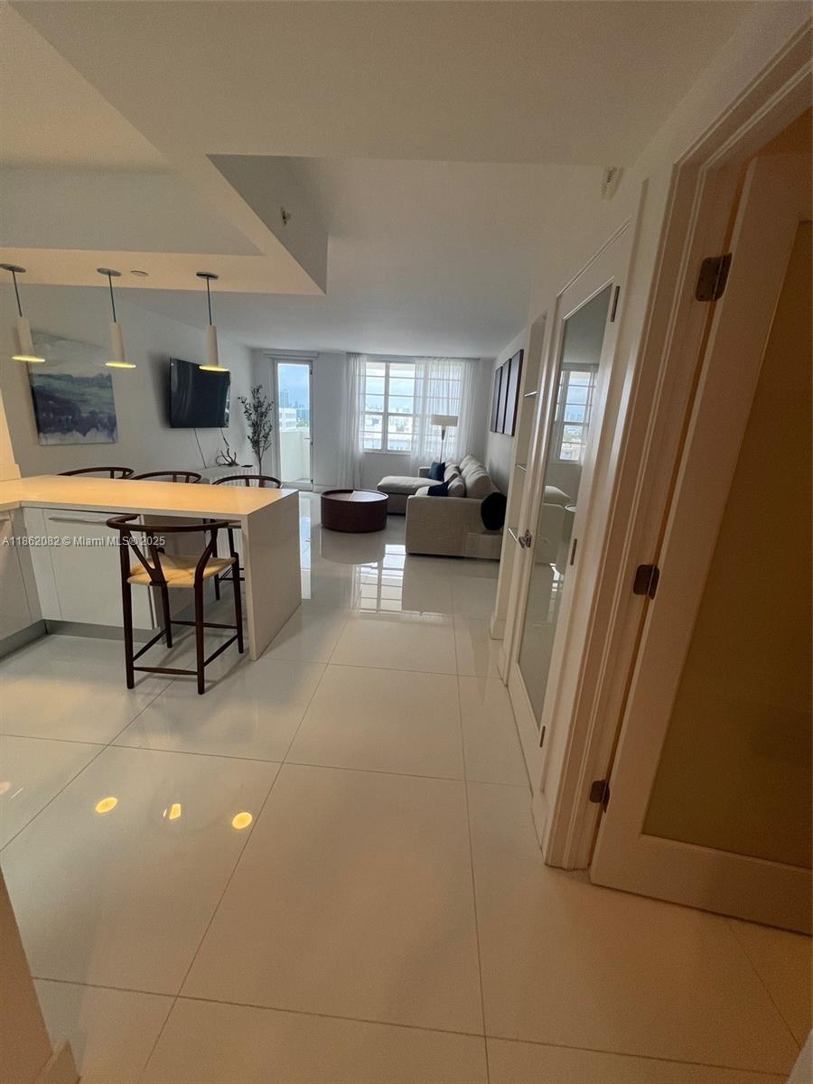 100 Lincoln Road, Unit 1022 Miami Beach, FL 33139 - Photo 22 of 63 a view of a livingroom with furniture and window
