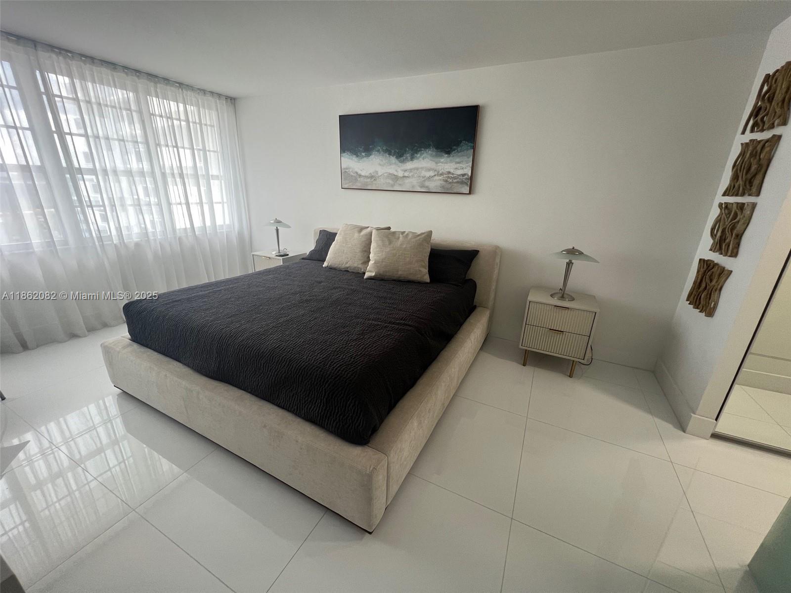 100 Lincoln Road, Unit 1022 Miami Beach, FL 33139 - Photo 24 of 63 a living room with furniture and a window