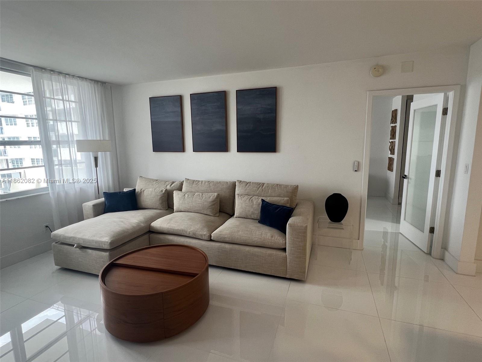 100 Lincoln Road, Unit 1022 Miami Beach, FL 33139 - Photo 3 of 63 a living room with furniture and a rug