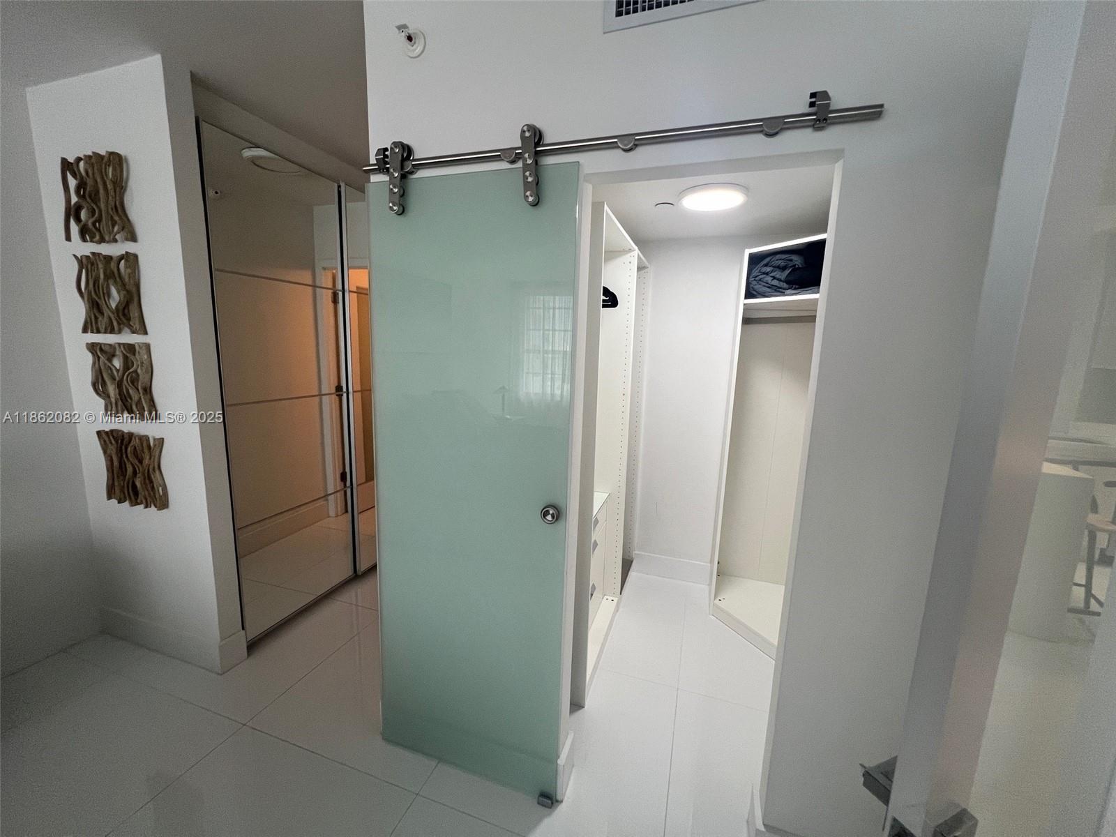 100 Lincoln Road, Unit 1022 Miami Beach, FL 33139 - Photo 34 of 63 a bathroom with a shower and a glass door
