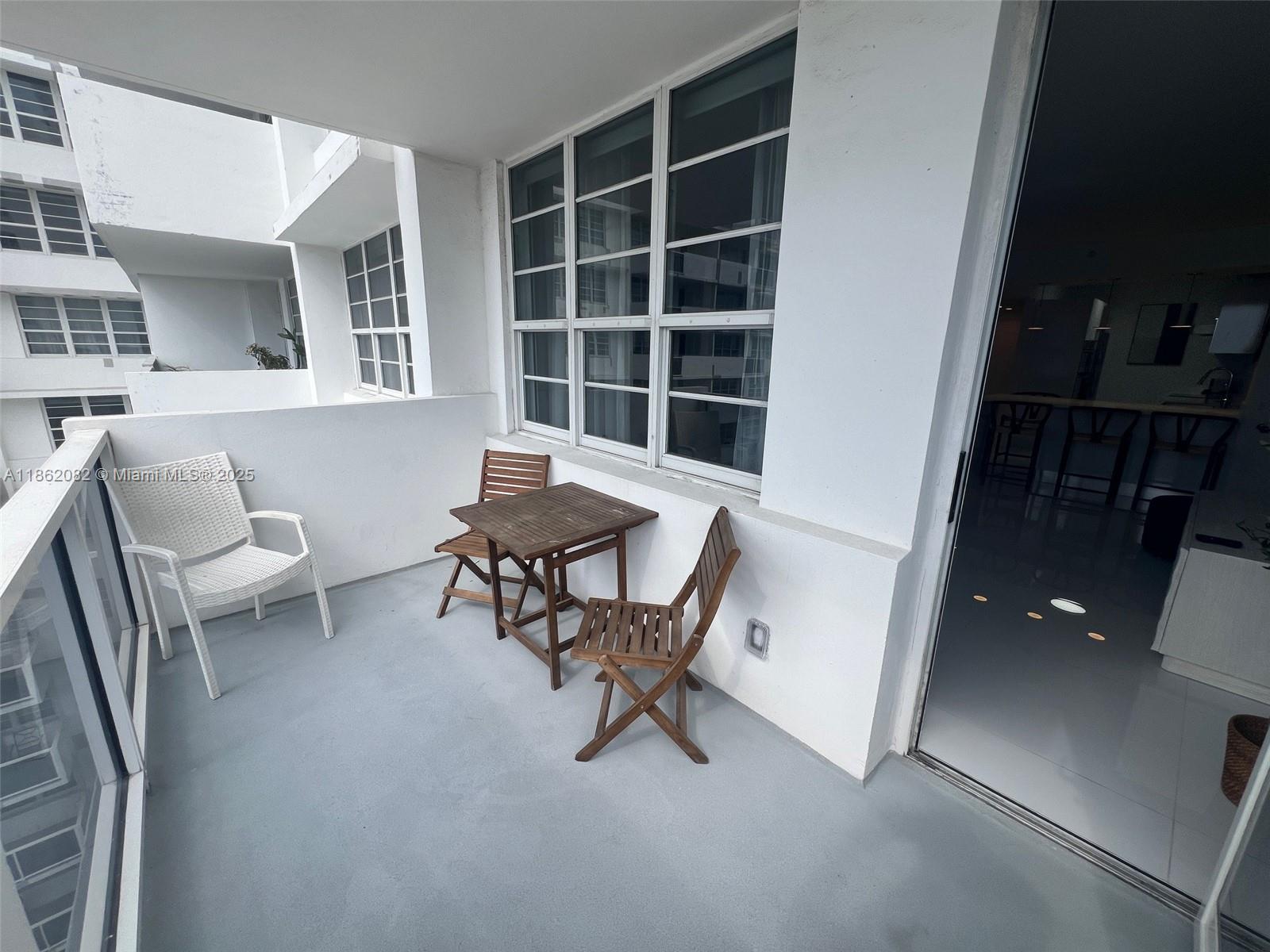 100 Lincoln Road, Unit 1022 Miami Beach, FL 33139 - Photo 40 of 63 a work room with furniture and a window