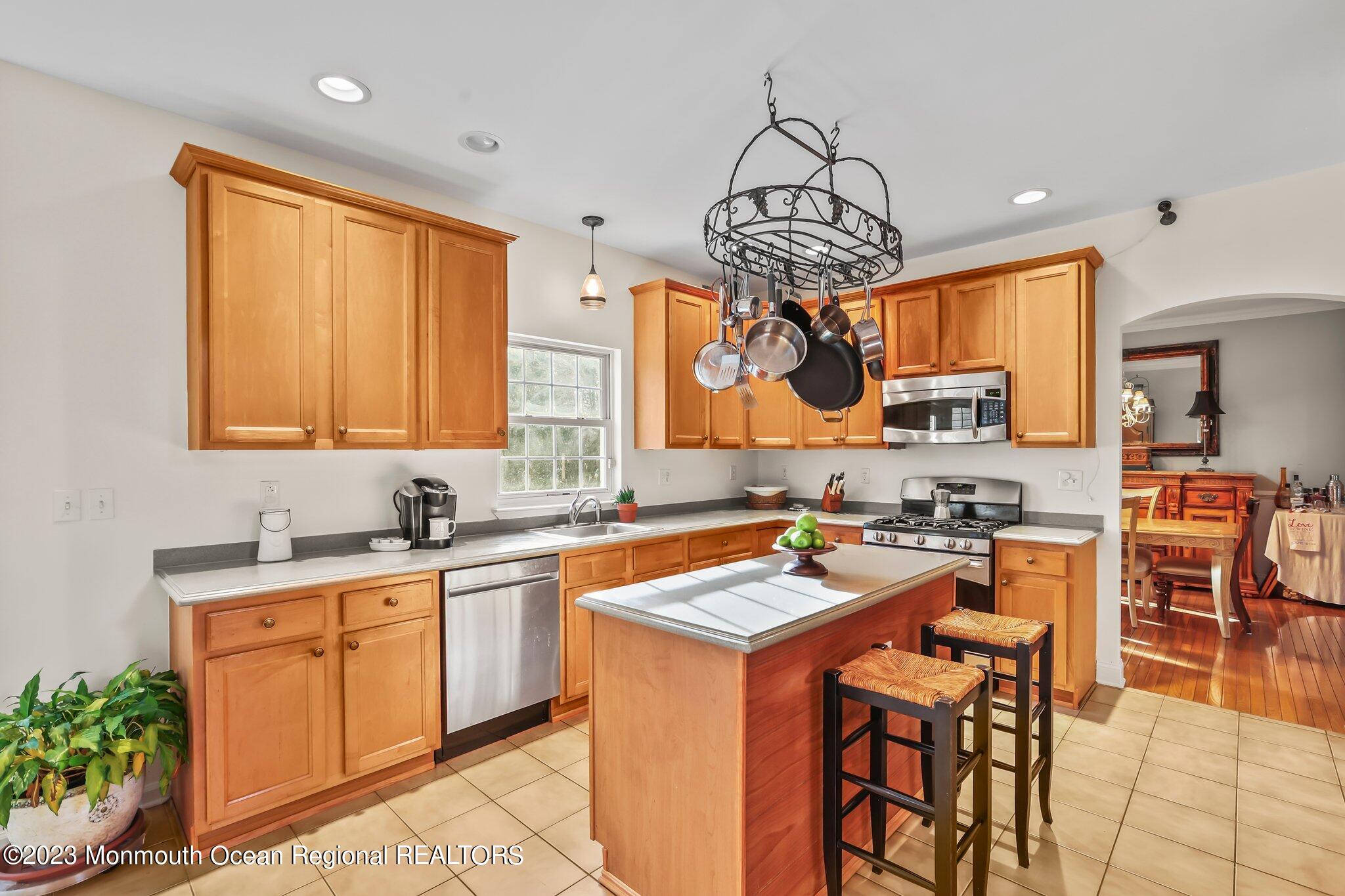 20 Round Hill Road Jackson, NJ 08527 - Photo 12 of 50 a kitchen with a sink a counter top space appliances and cabinets