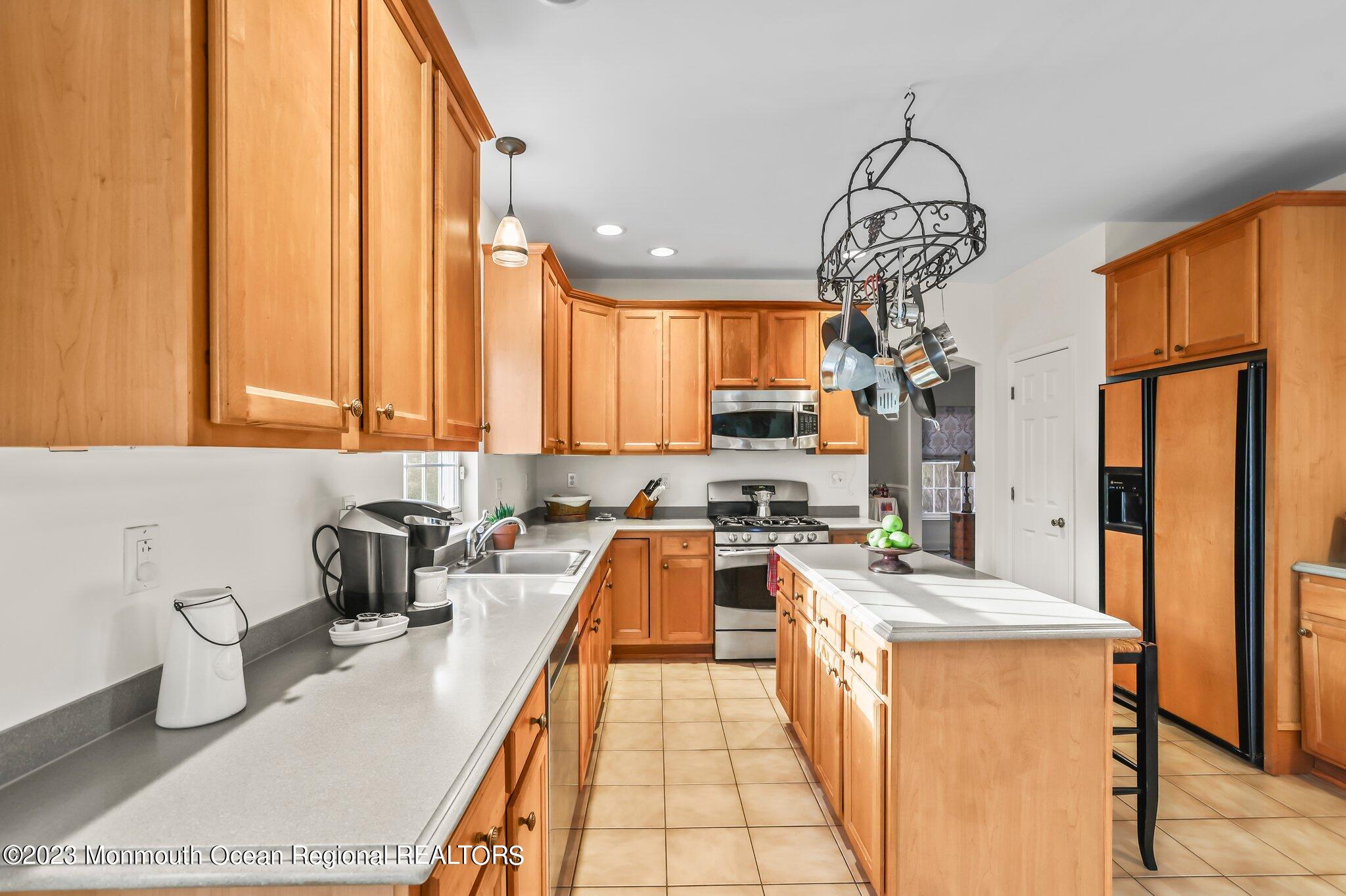 20 Round Hill Road Jackson, NJ 08527 - Photo 13 of 50 a kitchen with stainless steel appliances a counter space a sink a window and cabinets