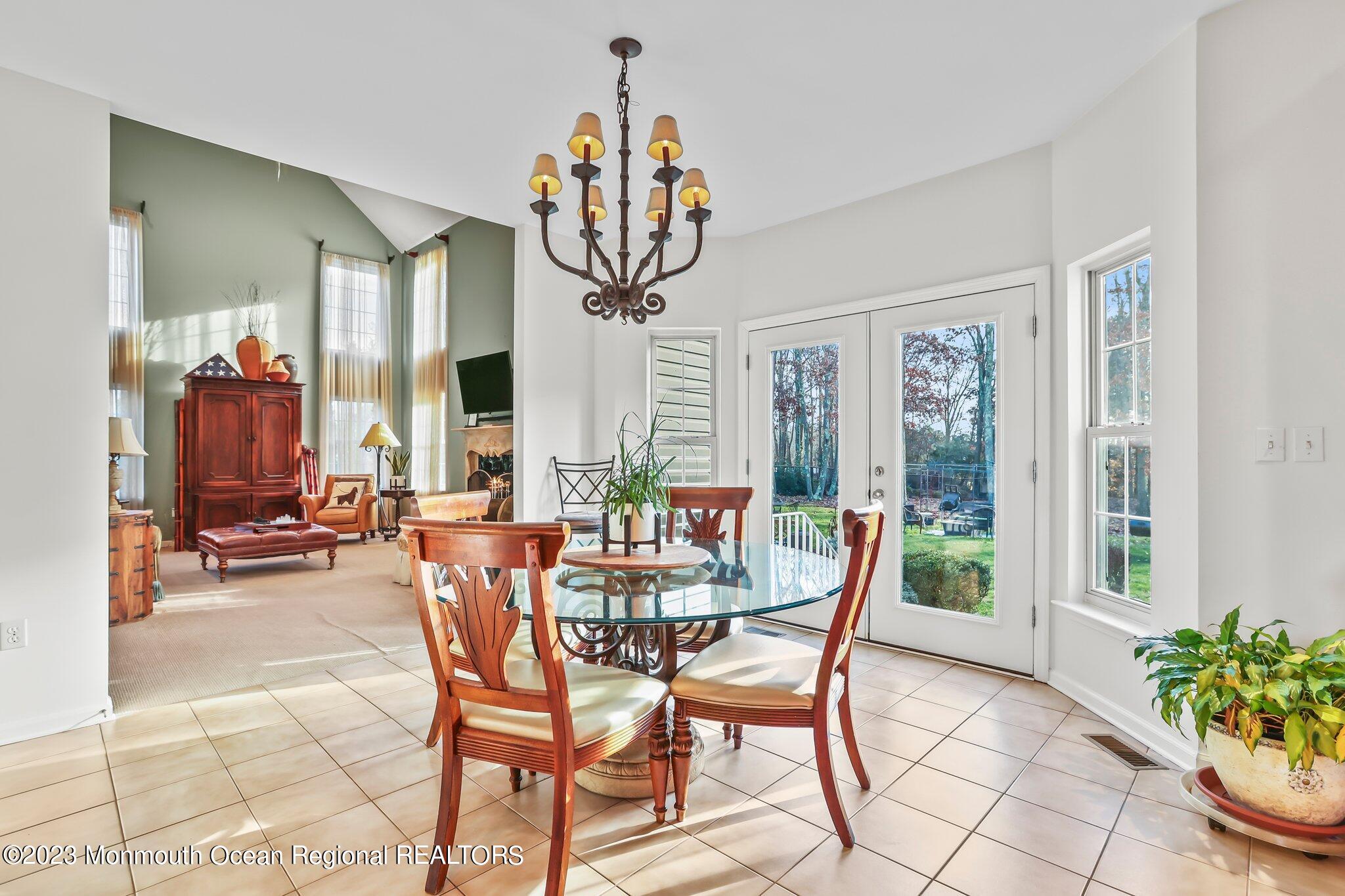 20 Round Hill Road Jackson, NJ 08527 - Photo 15 of 50 a dining room filled with furniture and a potted plant