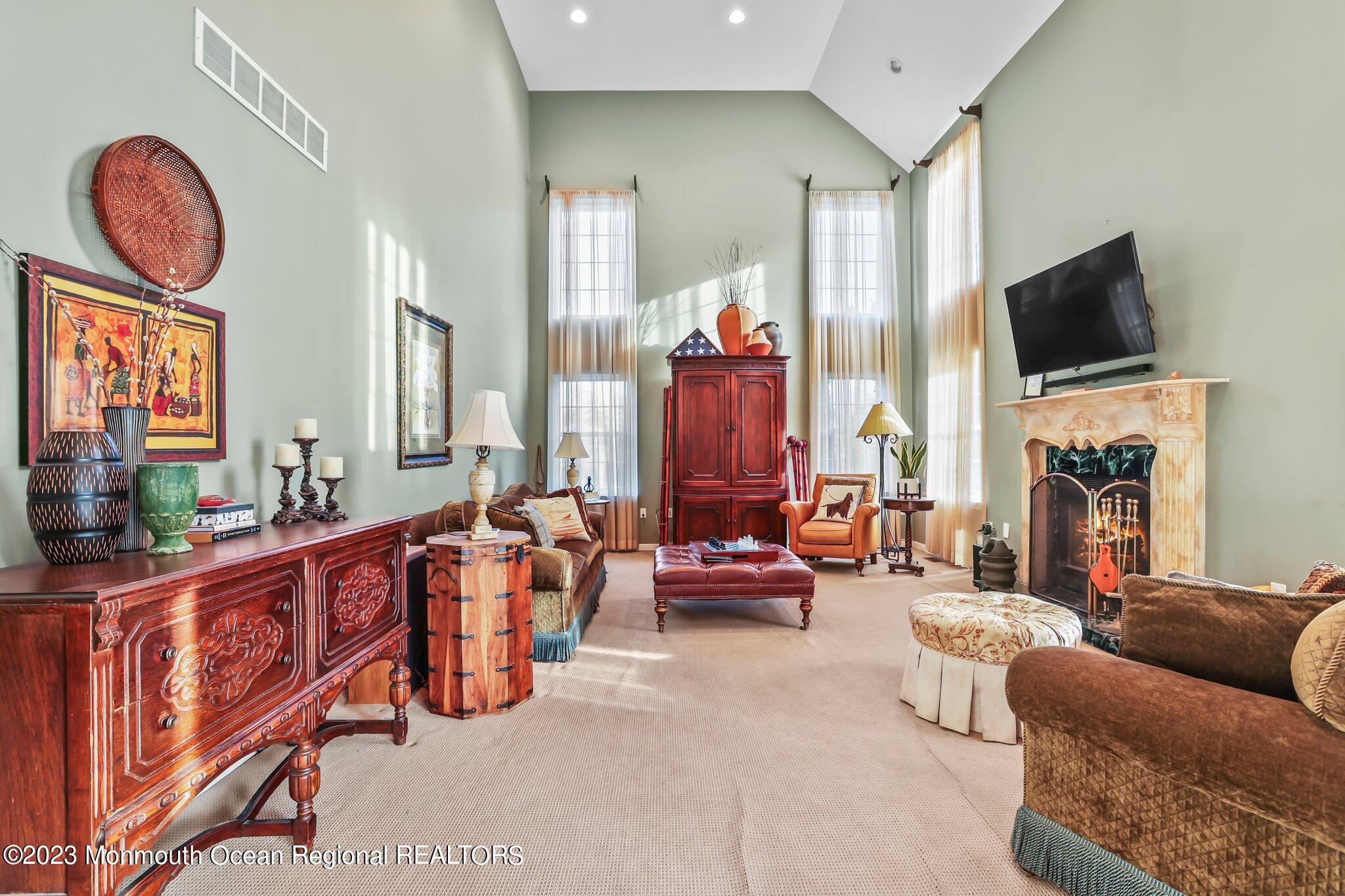 20 Round Hill Road Jackson, NJ 08527 - Photo 17 of 50 a living room with furniture fireplace and flat screen tv