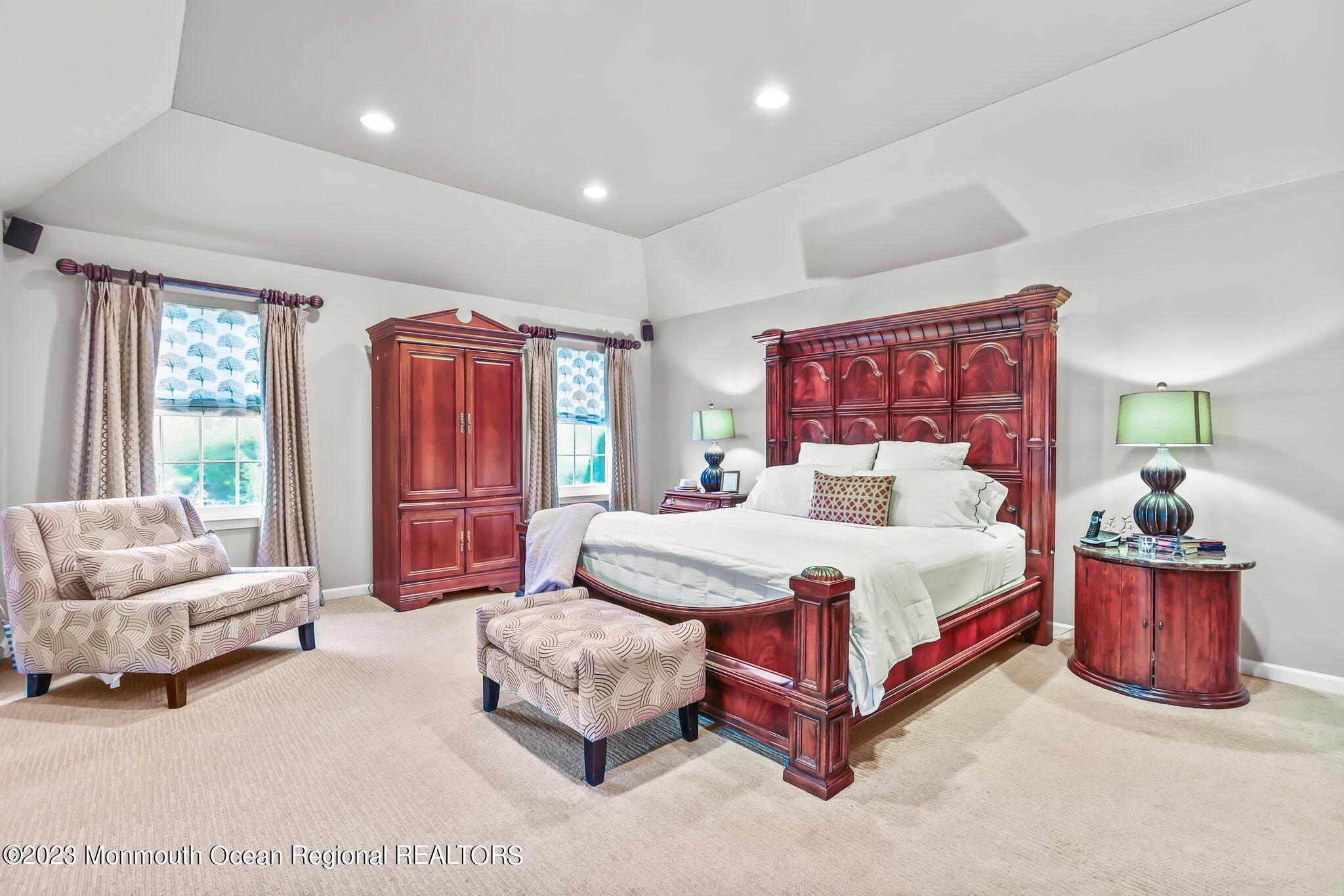 20 Round Hill Road Jackson, NJ 08527 - Photo 22 of 50 a spacious bedroom with a bed and a couch