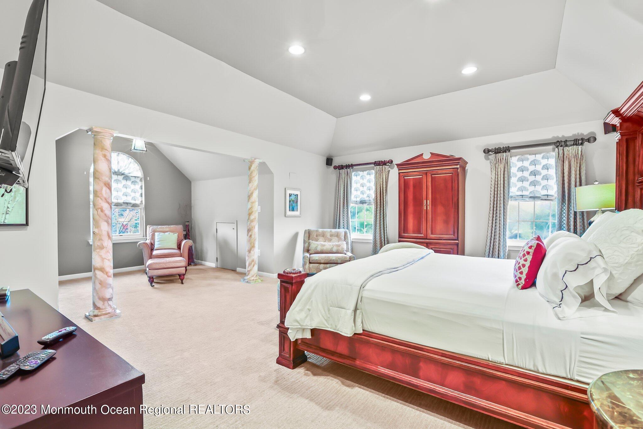 20 Round Hill Road Jackson, NJ 08527 - Photo 23 of 50 a bedroom with a bed couch and a large window