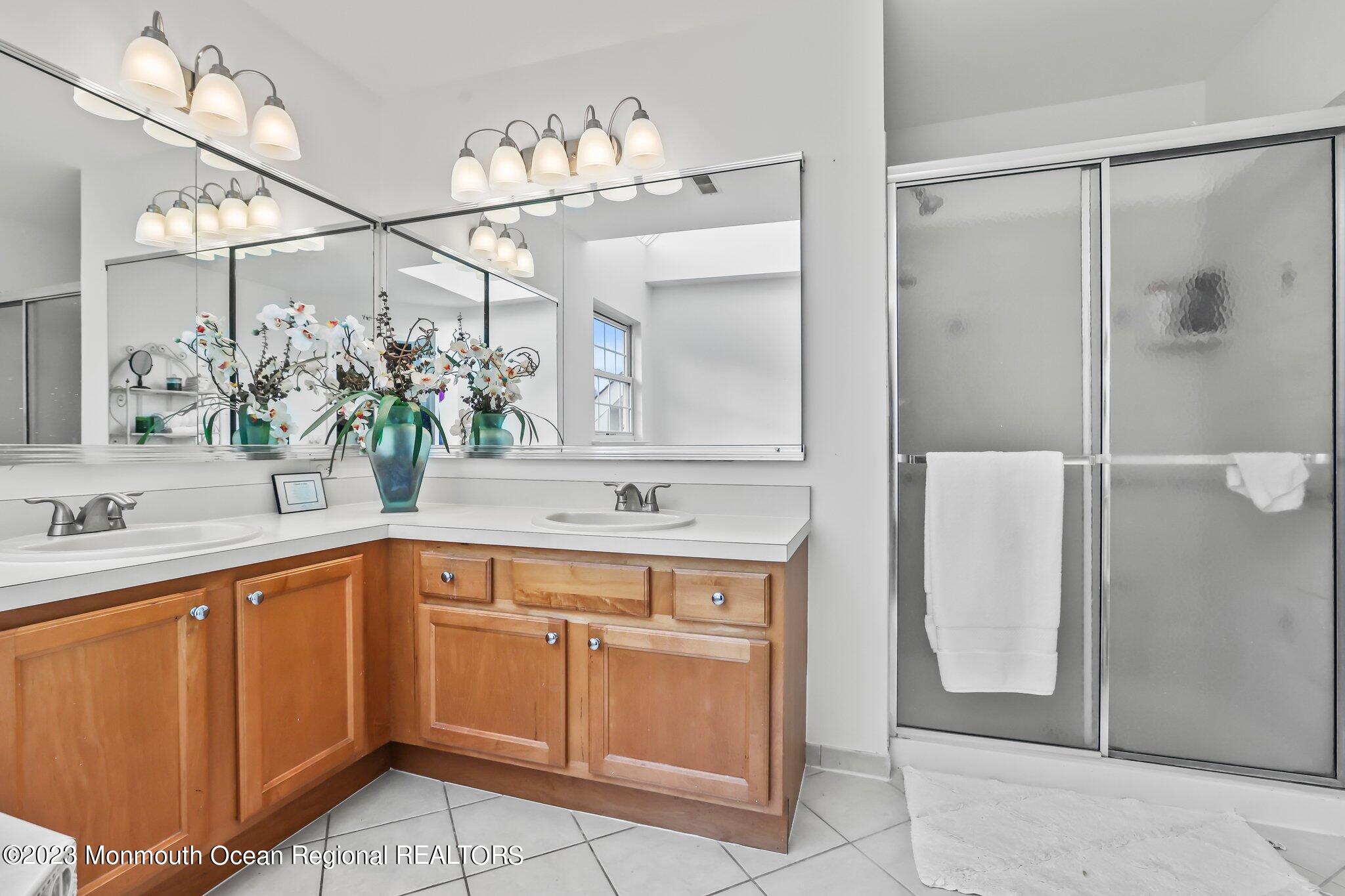20 Round Hill Road Jackson, NJ 08527 - Photo 26 of 50 a spacious bathroom with a sink and a mirror