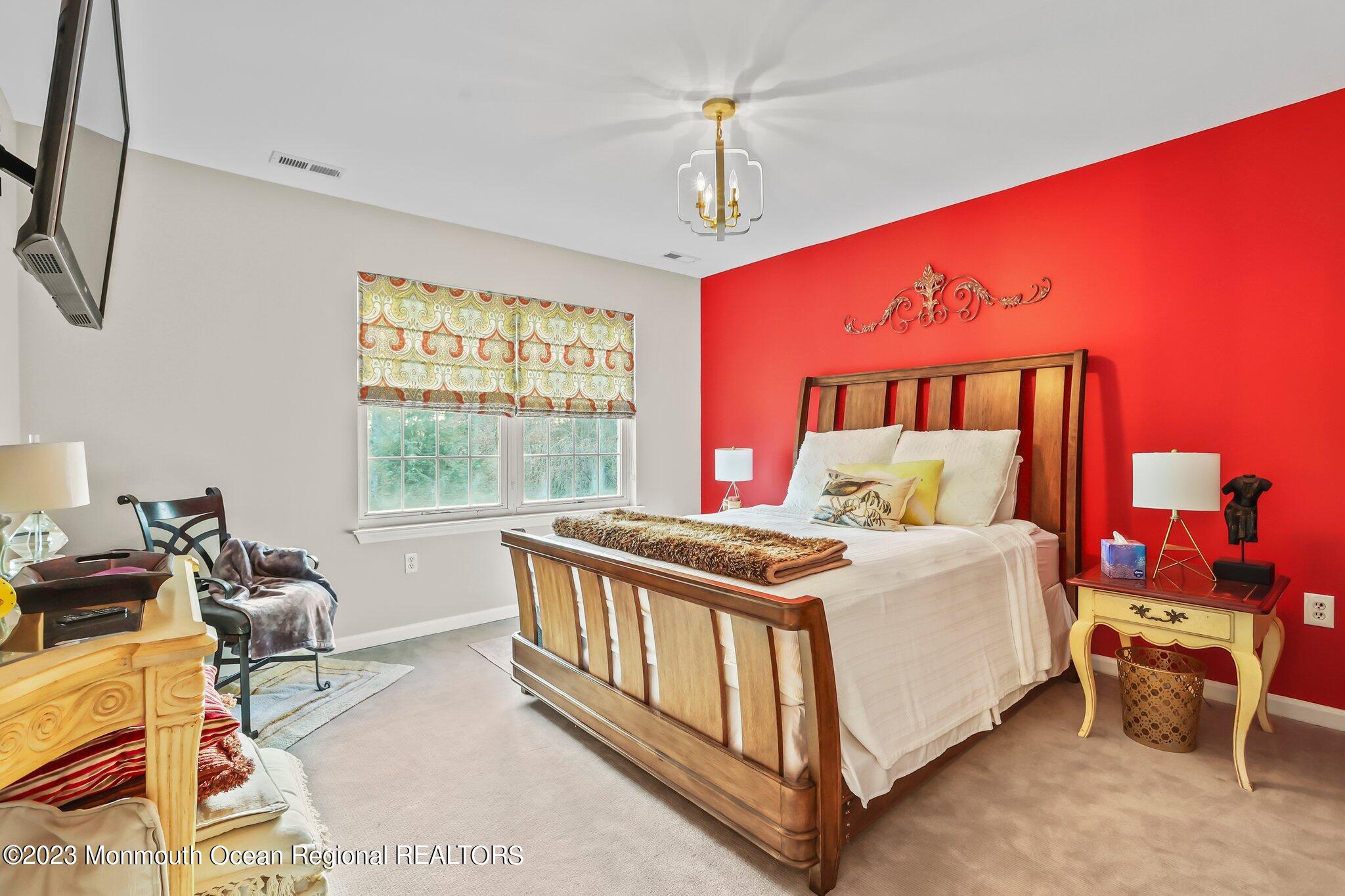 20 Round Hill Road Jackson, NJ 08527 - Photo 28 of 50 a bed room with a bed and a window