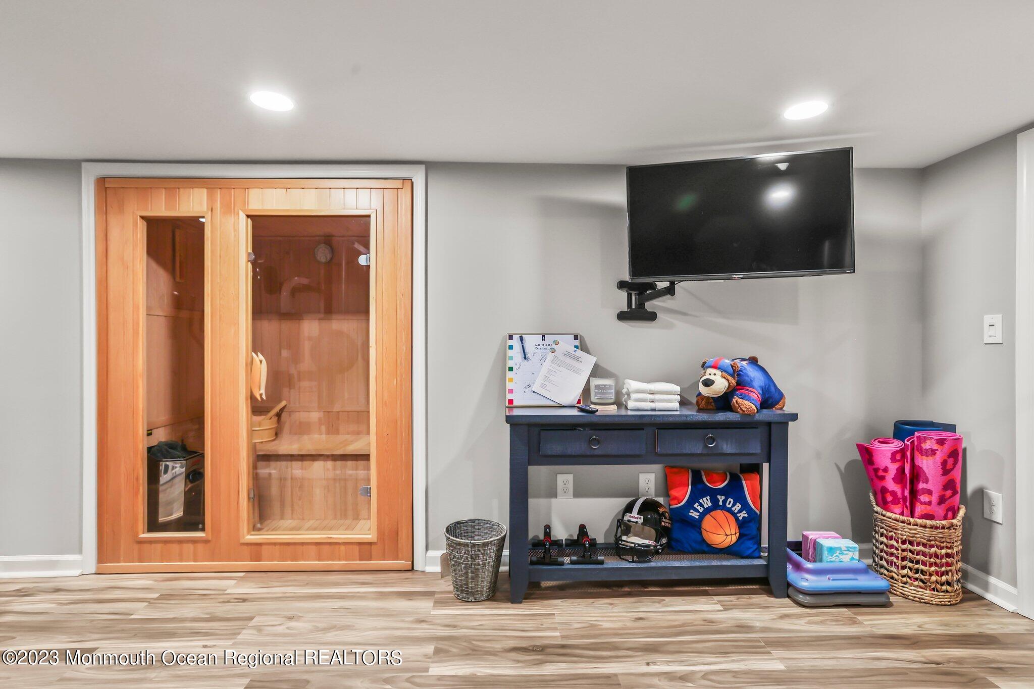 20 Round Hill Road Jackson, NJ 08527 - Photo 38 of 50 a living room with furniture and a flat screen tv
