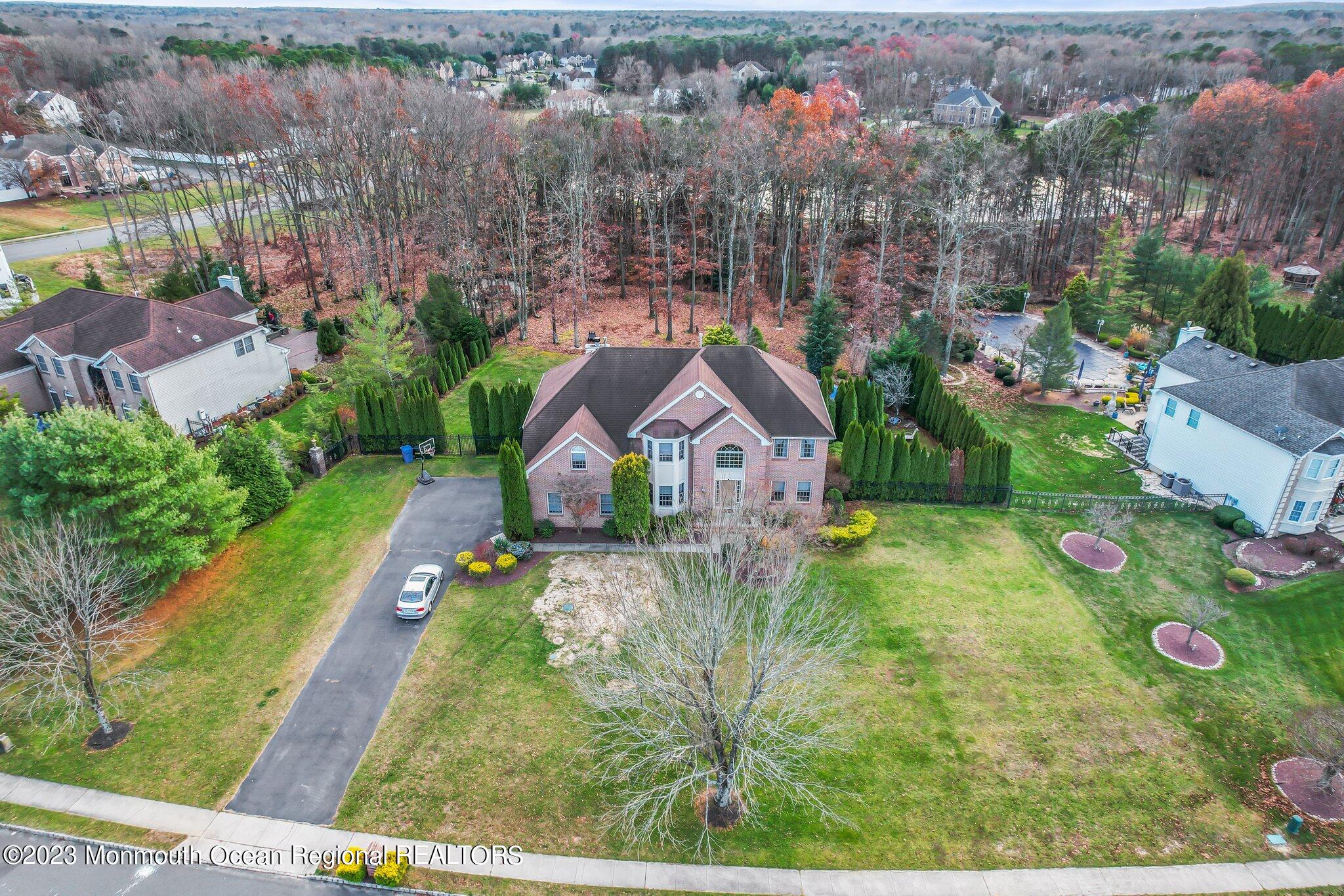 20 Round Hill Road Jackson, NJ 08527 - Photo 42 of 50 an aerial view of a house with a yard