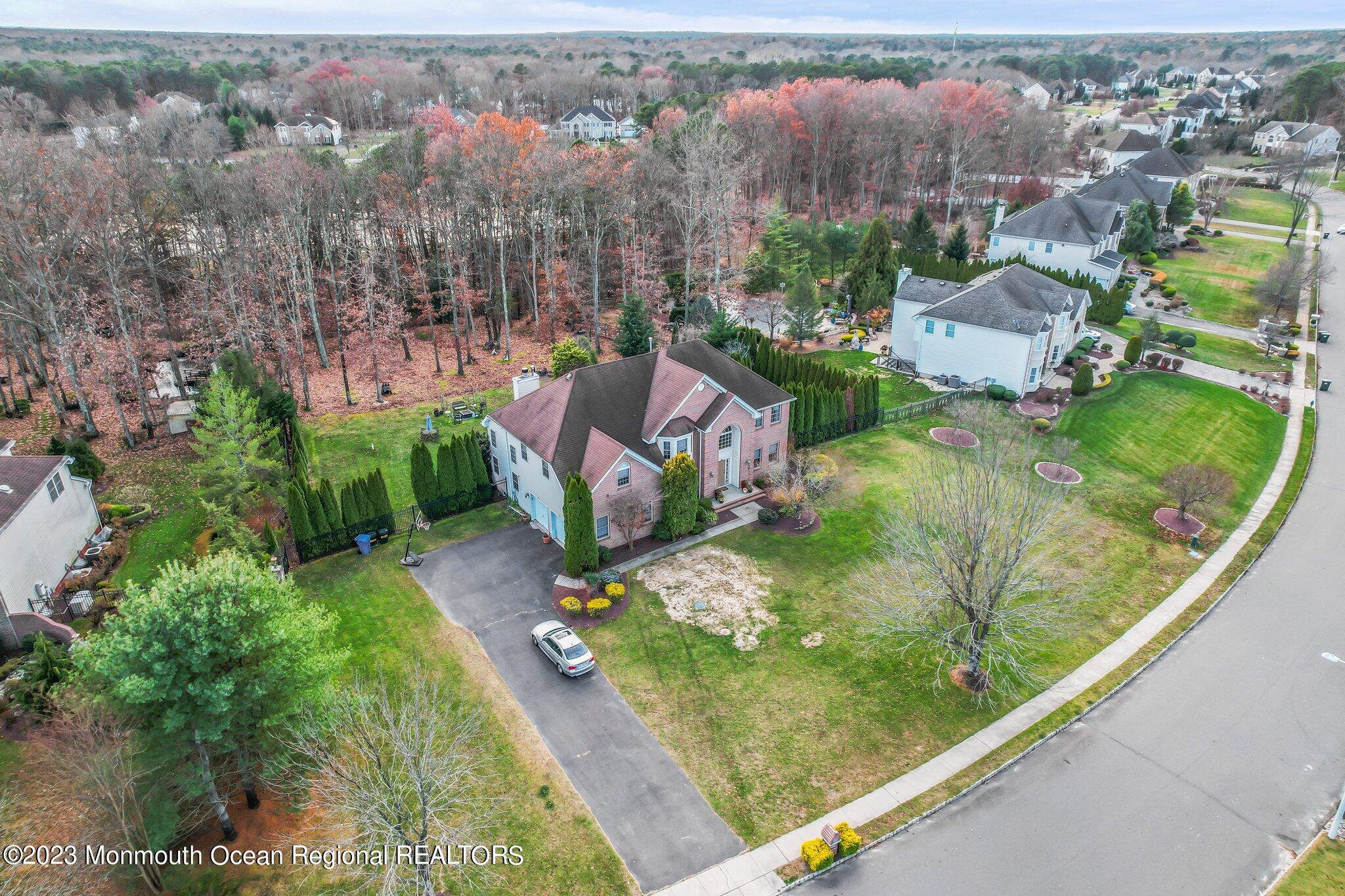 20 Round Hill Road Jackson, NJ 08527 - Photo 43 of 50 an aerial view of a house with a yard