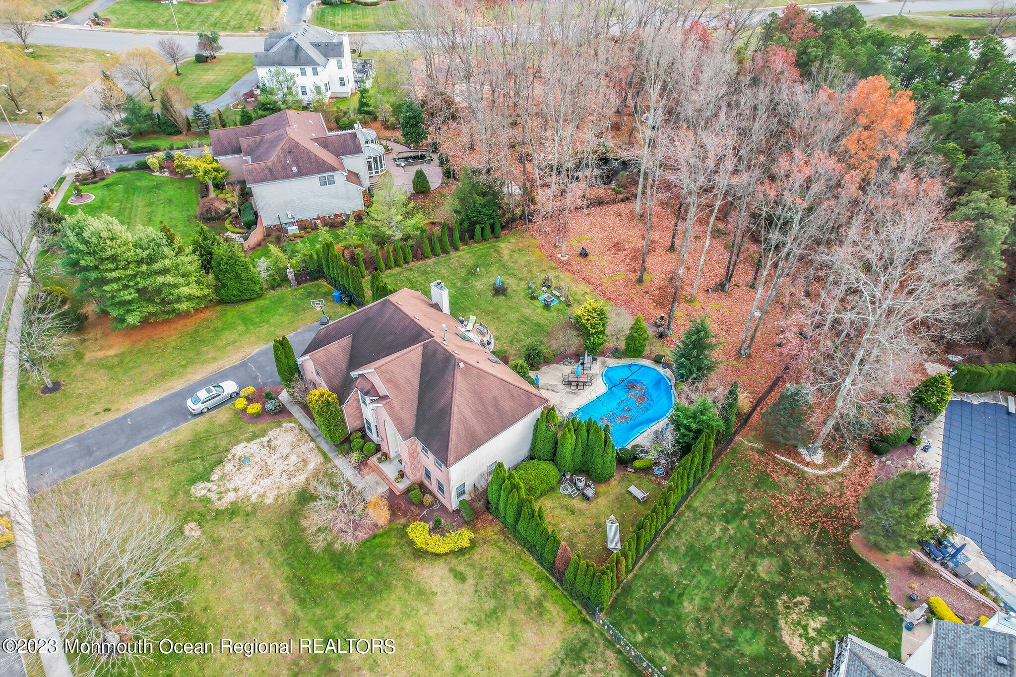 20 Round Hill Road Jackson, NJ 08527 - Photo 45 of 50 a aerial view of a house with a yard and lake view