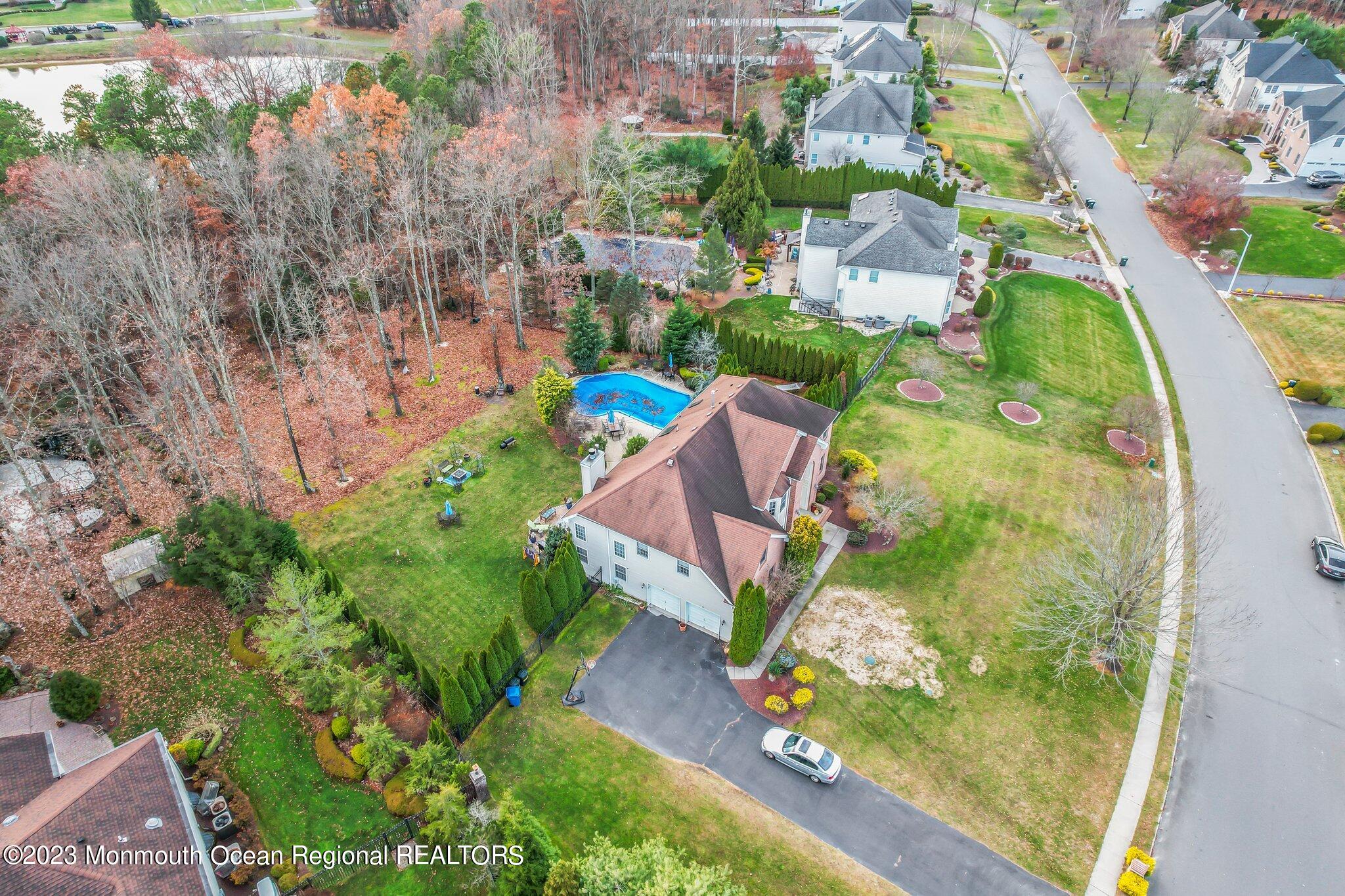 20 Round Hill Road Jackson, NJ 08527 - Photo 46 of 50 an aerial view of a house with a yard and lake view