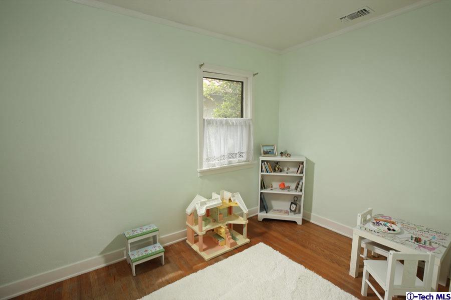 2118 Maiden Lane Altadena, CA 91001 - Photo 9 of 15 a bedroom with furniture and a window