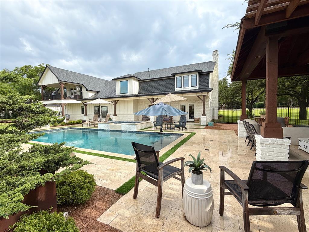 1304 Tinker Road Colleyville, TX 76034 - Photo 25 of 28 a view of swimming pool with outdoor seating and plants