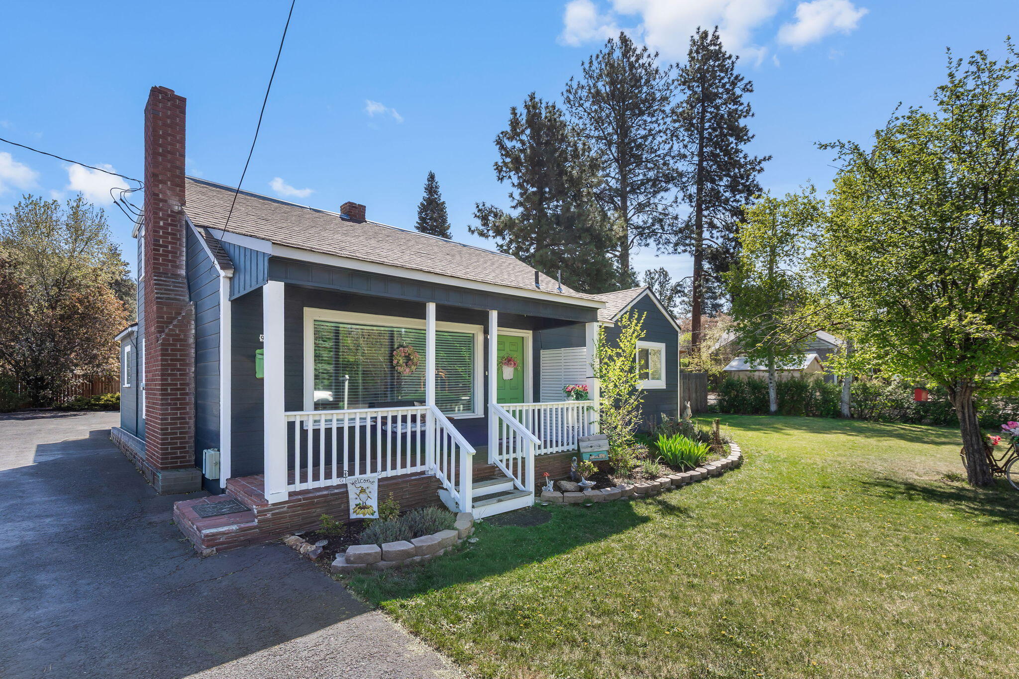924 Northeast 9th Street Bend, OR 97701 - Photo 1 of 40 a view of a house with backyard porch and sitting area