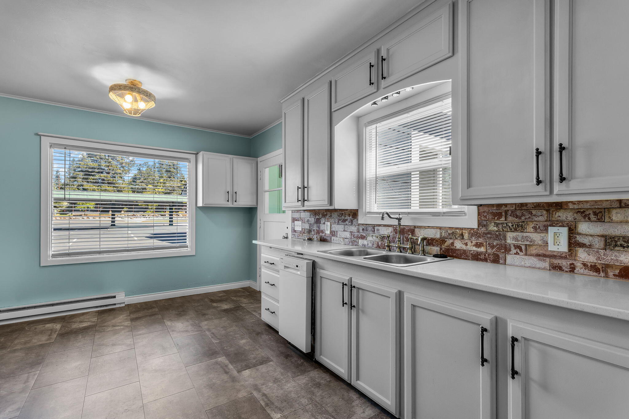 924 Northeast 9th Street Bend, OR 97701 - Photo 15 of 40 a kitchen with sink cabinets and window