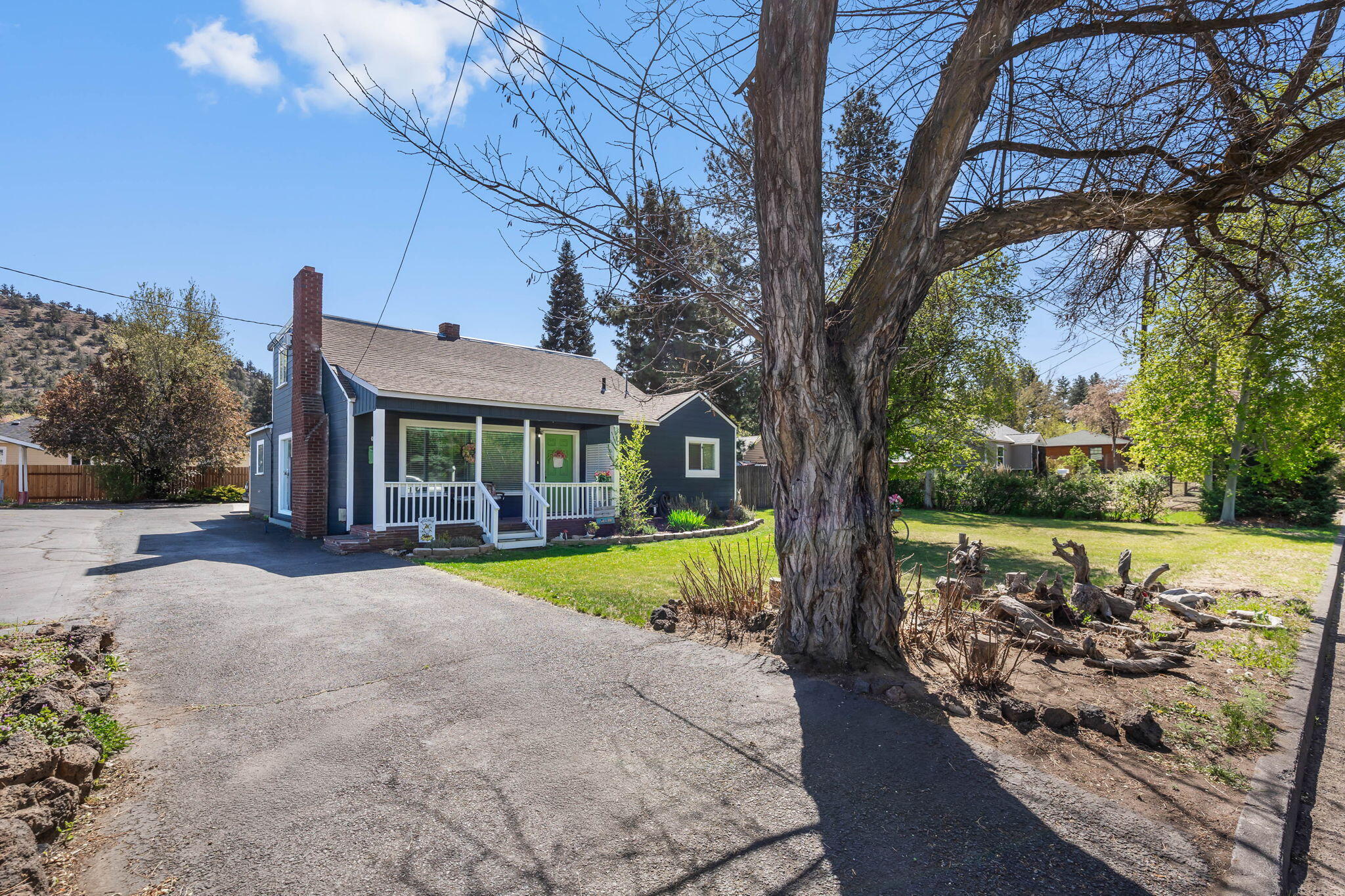 924 Northeast 9th Street Bend, OR 97701 - Photo 2 of 40 a view of a house with backyard porch and sitting area