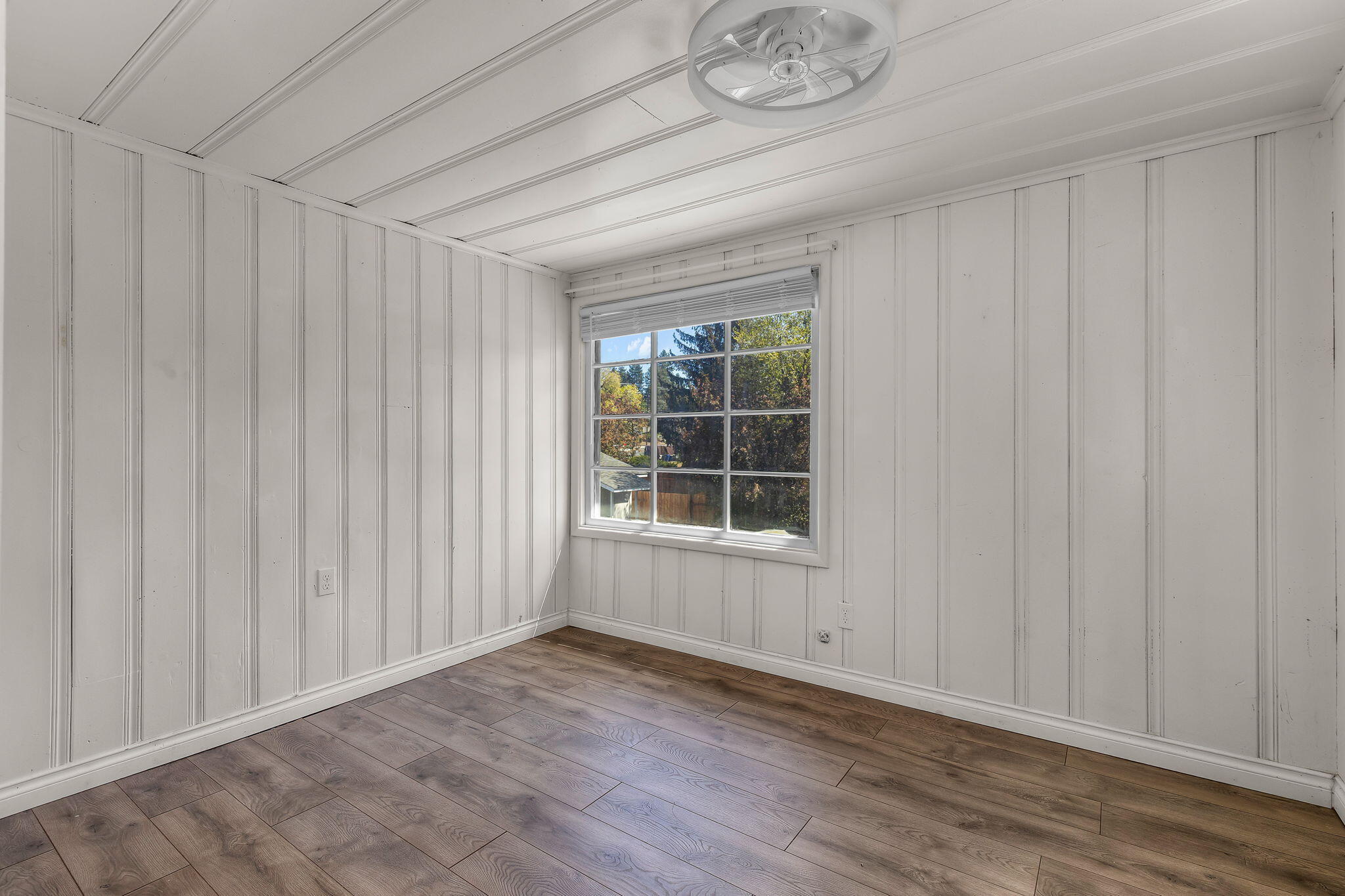 924 Northeast 9th Street Bend, OR 97701 - Photo 25 of 40 an empty room with wooden floor and windows