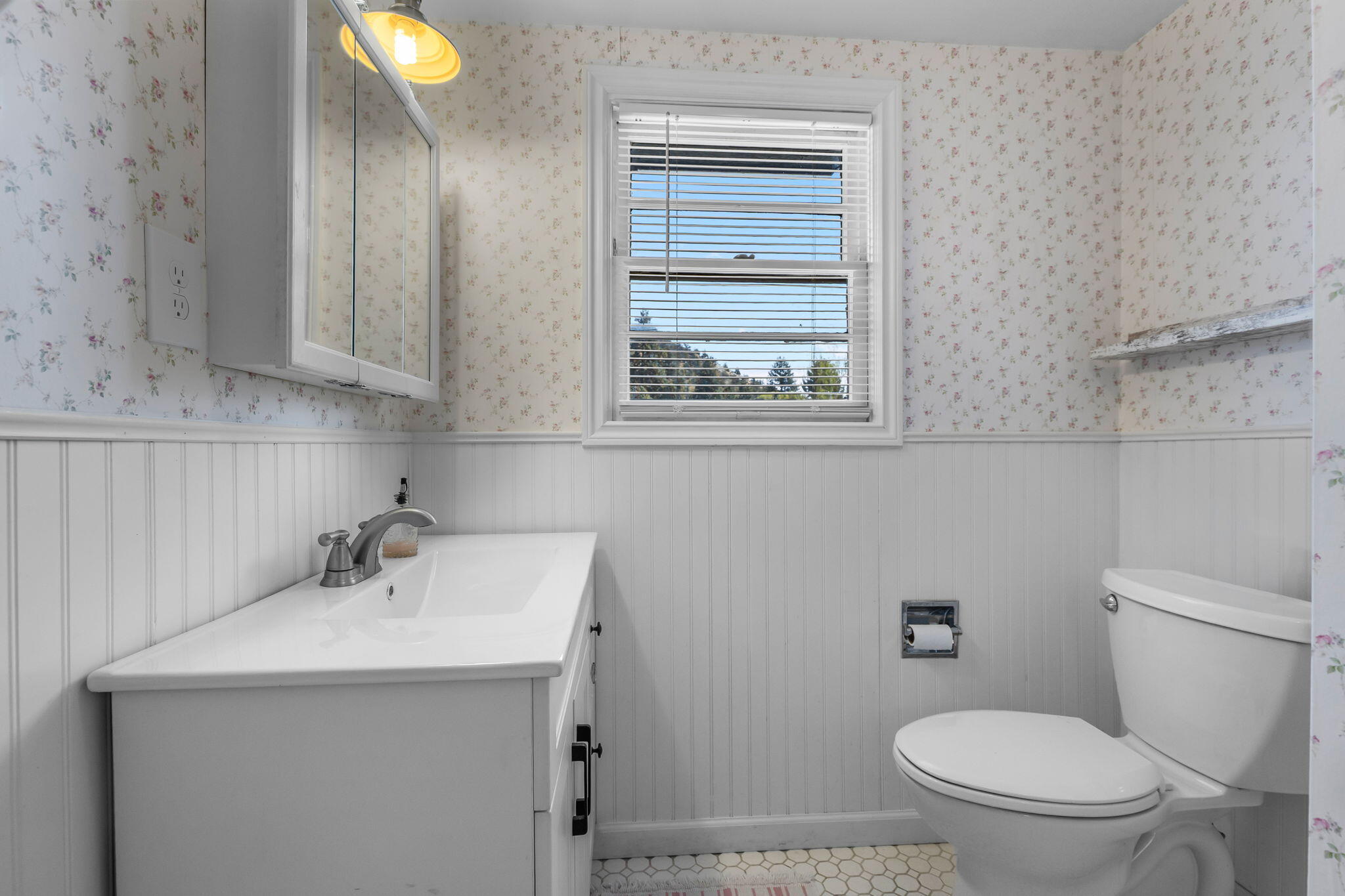 924 Northeast 9th Street Bend, OR 97701 - Photo 28 of 40 a bathroom with a sink a toilet and mirror