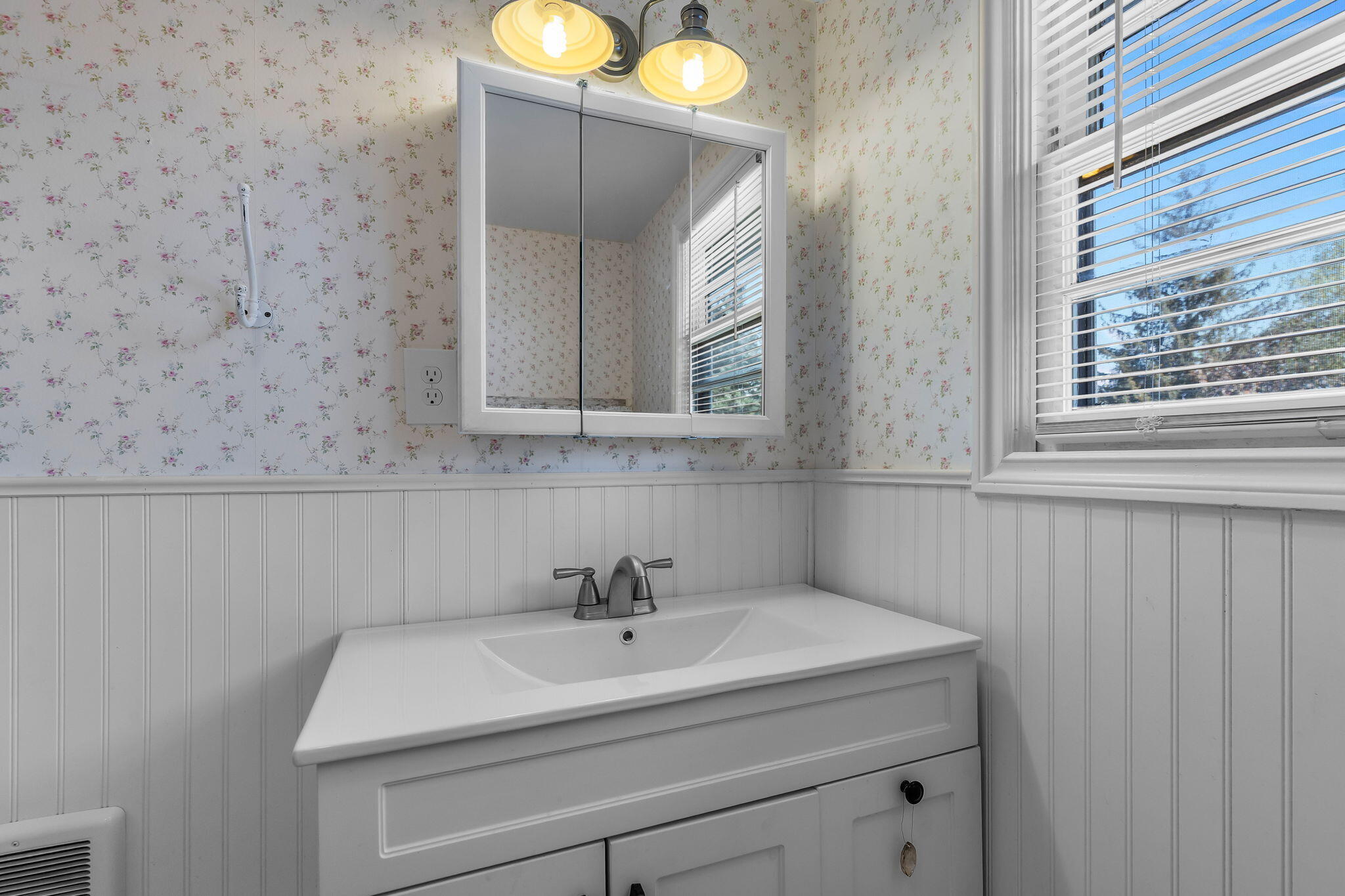 924 Northeast 9th Street Bend, OR 97701 - Photo 29 of 40 a bathroom with a sink and a mirror