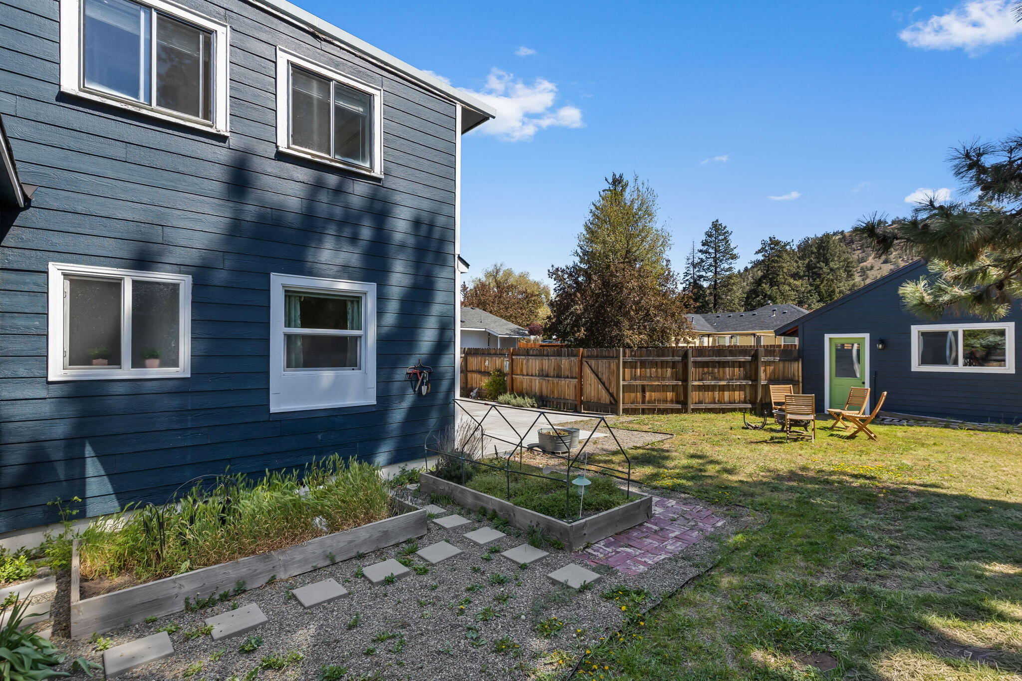 924 Northeast 9th Street Bend, OR 97701 - Photo 38 of 40 a backyard of a house with yard table and chairs