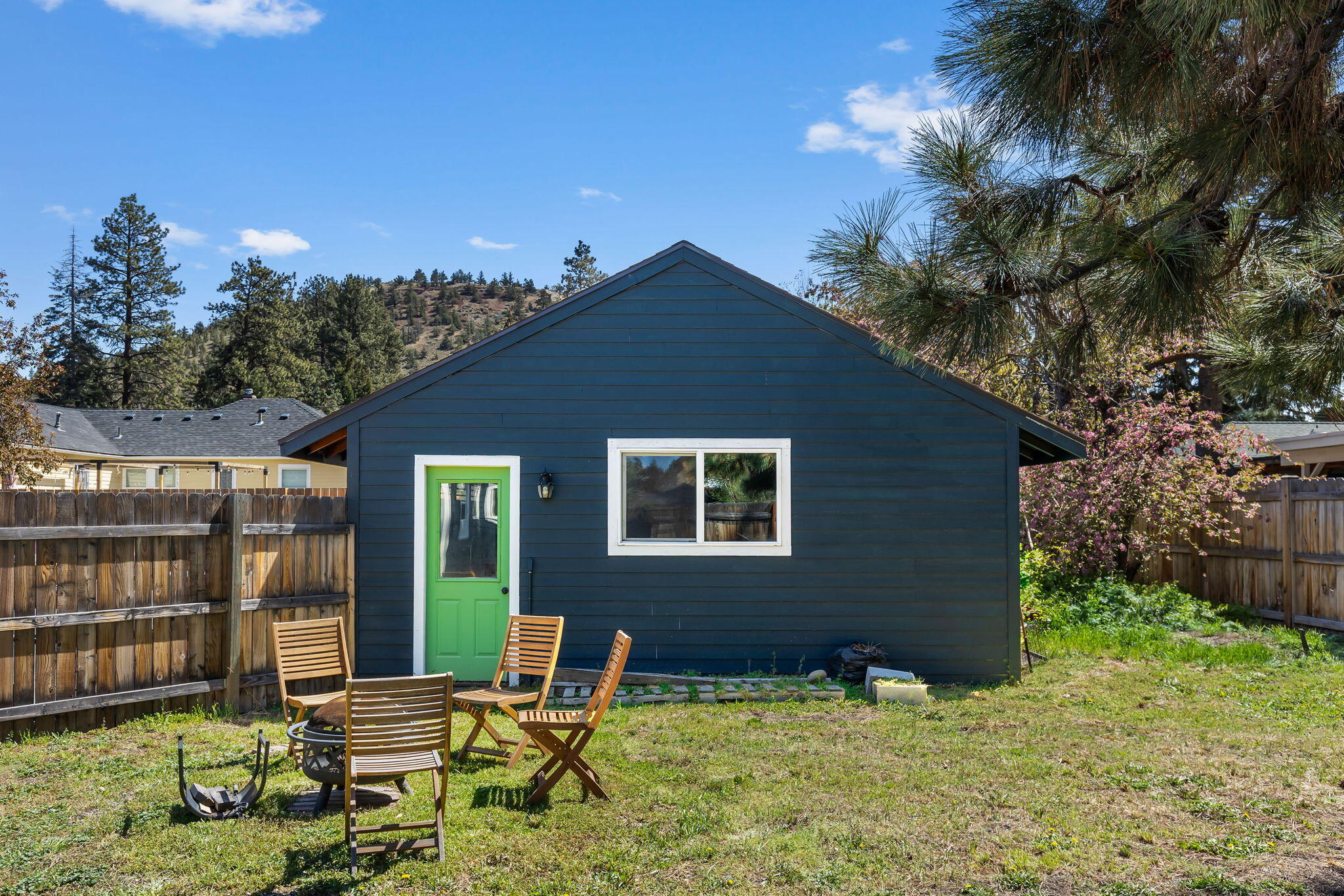 924 Northeast 9th Street Bend, OR 97701 - Photo 39 of 40 a backyard of a house with yard and outdoor seating