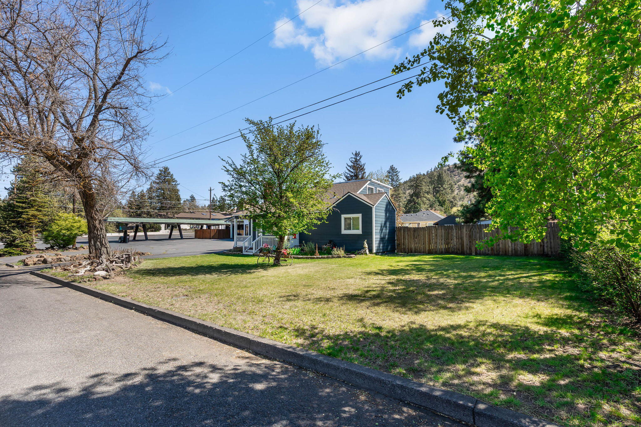 924 Northeast 9th Street Bend, OR 97701 - Photo 4 of 40 a front view of a house with a yard and trees