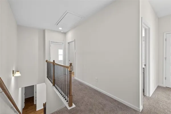 a view of a hallway with staircase