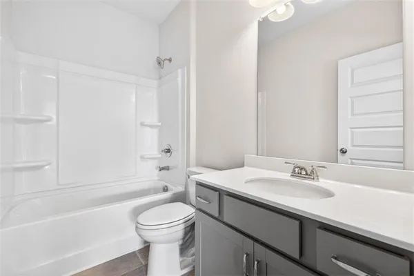 a bathroom with a sink a toilet and a bathtub