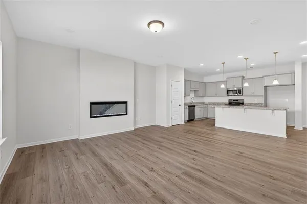 a view of kitchen with wooden floor and window