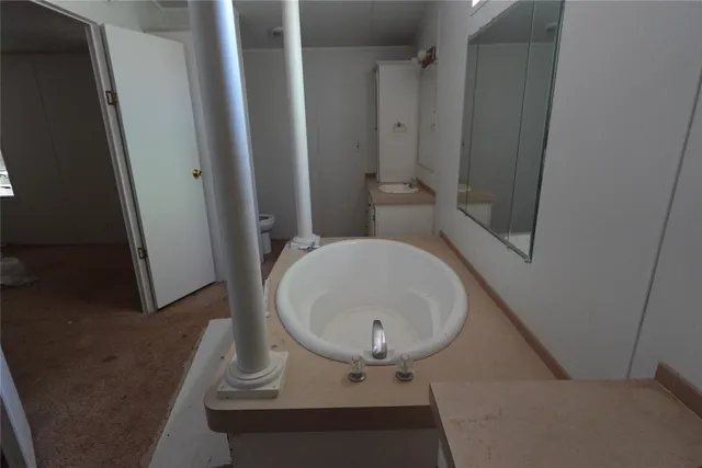 a bathroom with a sink and toilet