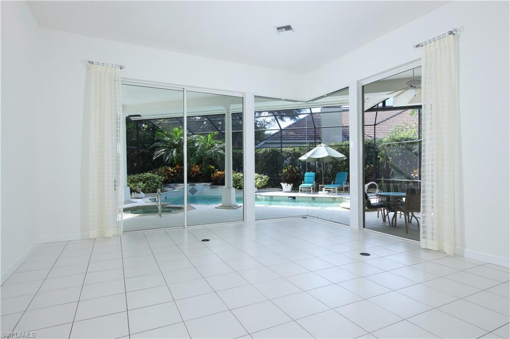 720 Turkey Oak Lane Naples, FL 34108 - Photo 5 of 17 a view of livingroom with furniture and floor to ceiling window