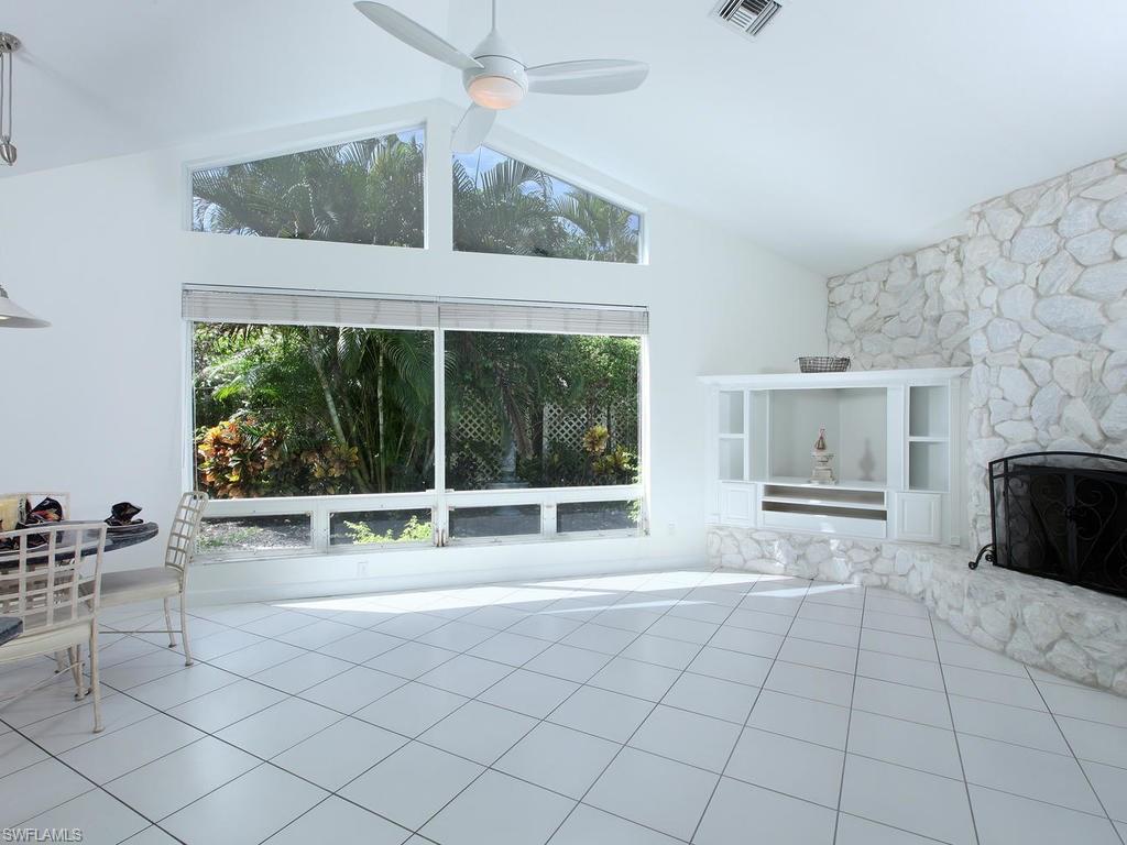 720 Turkey Oak Lane Naples, FL 34108 - Photo 8 of 17 a view of workspace with furniture and window