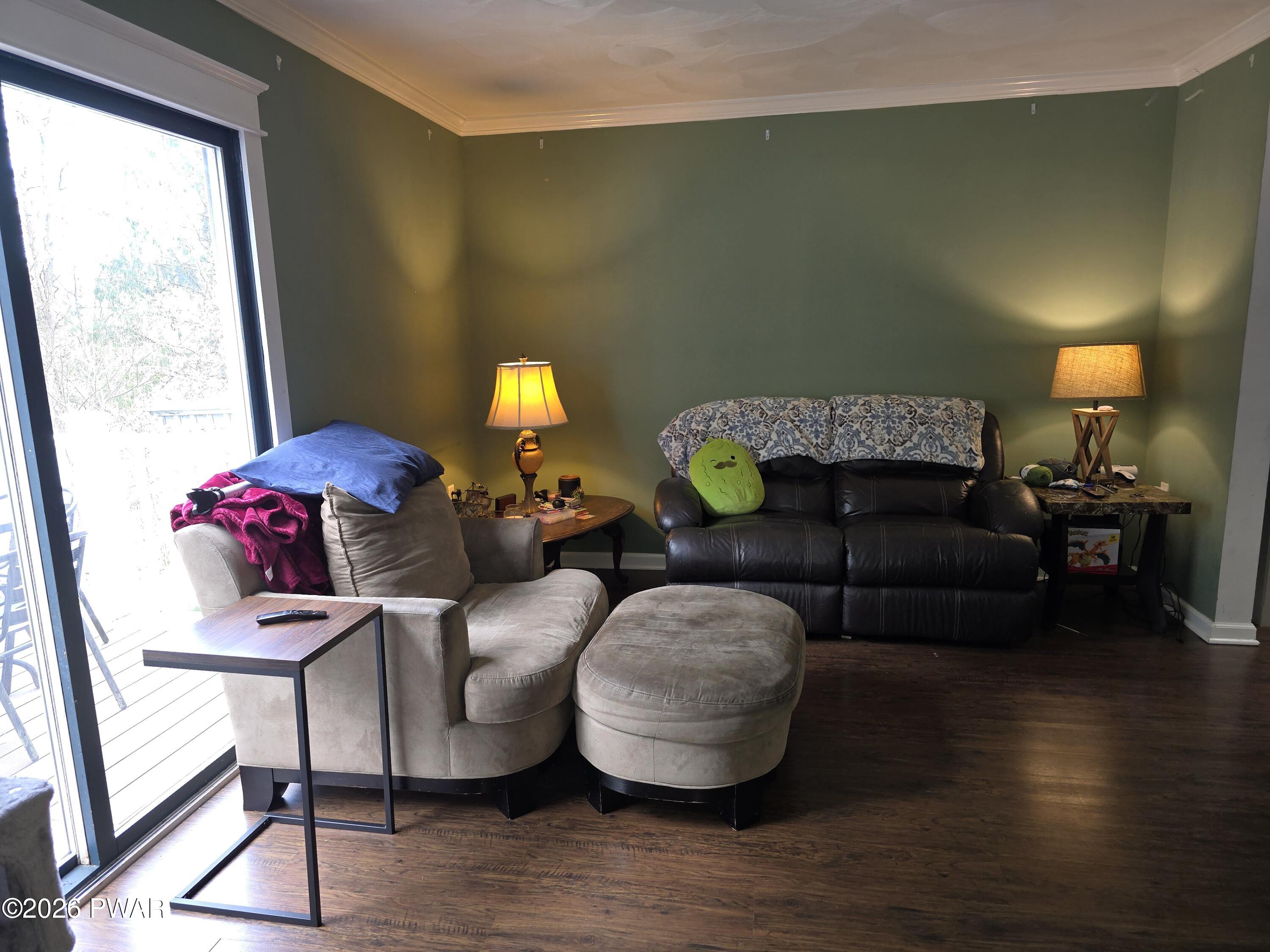 107 Keystone Hls Road, Unit 404 Factoryville, PA 18419 - Photo 16 of 23 a living room with furniture and wooden floor
