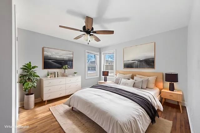 a bedroom with a large bed and a flat screen tv