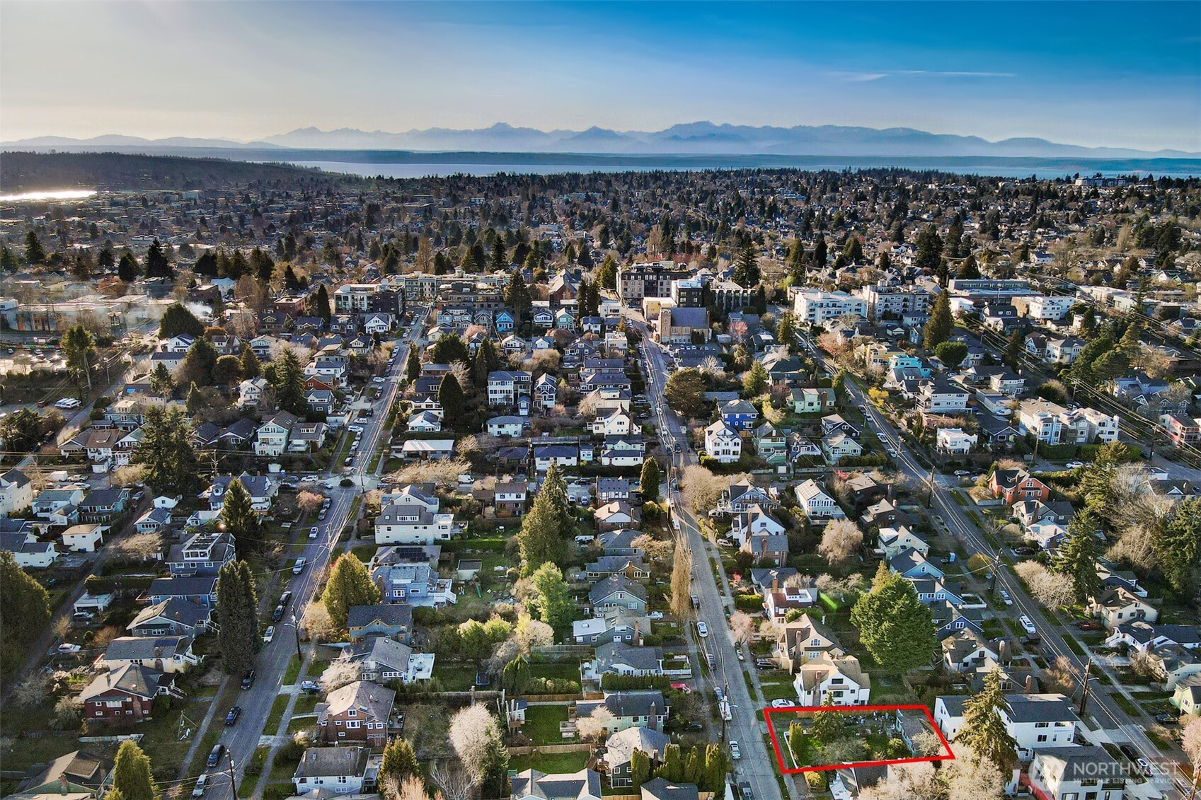 528 North 70th Street Seattle, WA 98103 - Photo 11 of 11 an aerial view of house with yard and mountain view in back