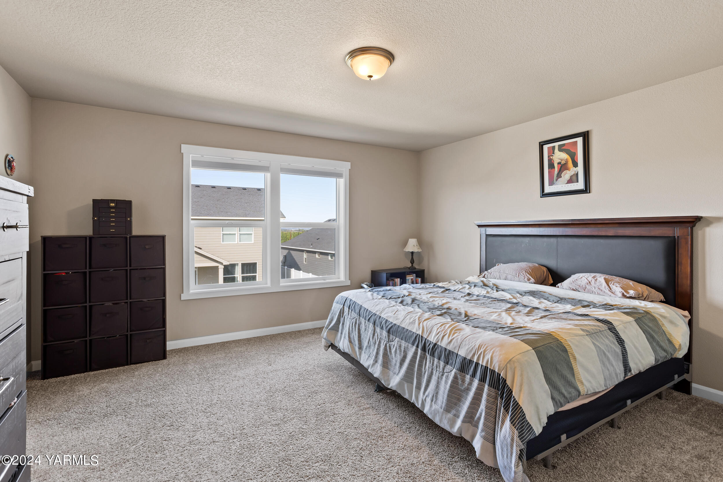 2100 Amber Loop Yakima, WA 98901 - Photo 12 of 25 a bedroom with a bed and dresser