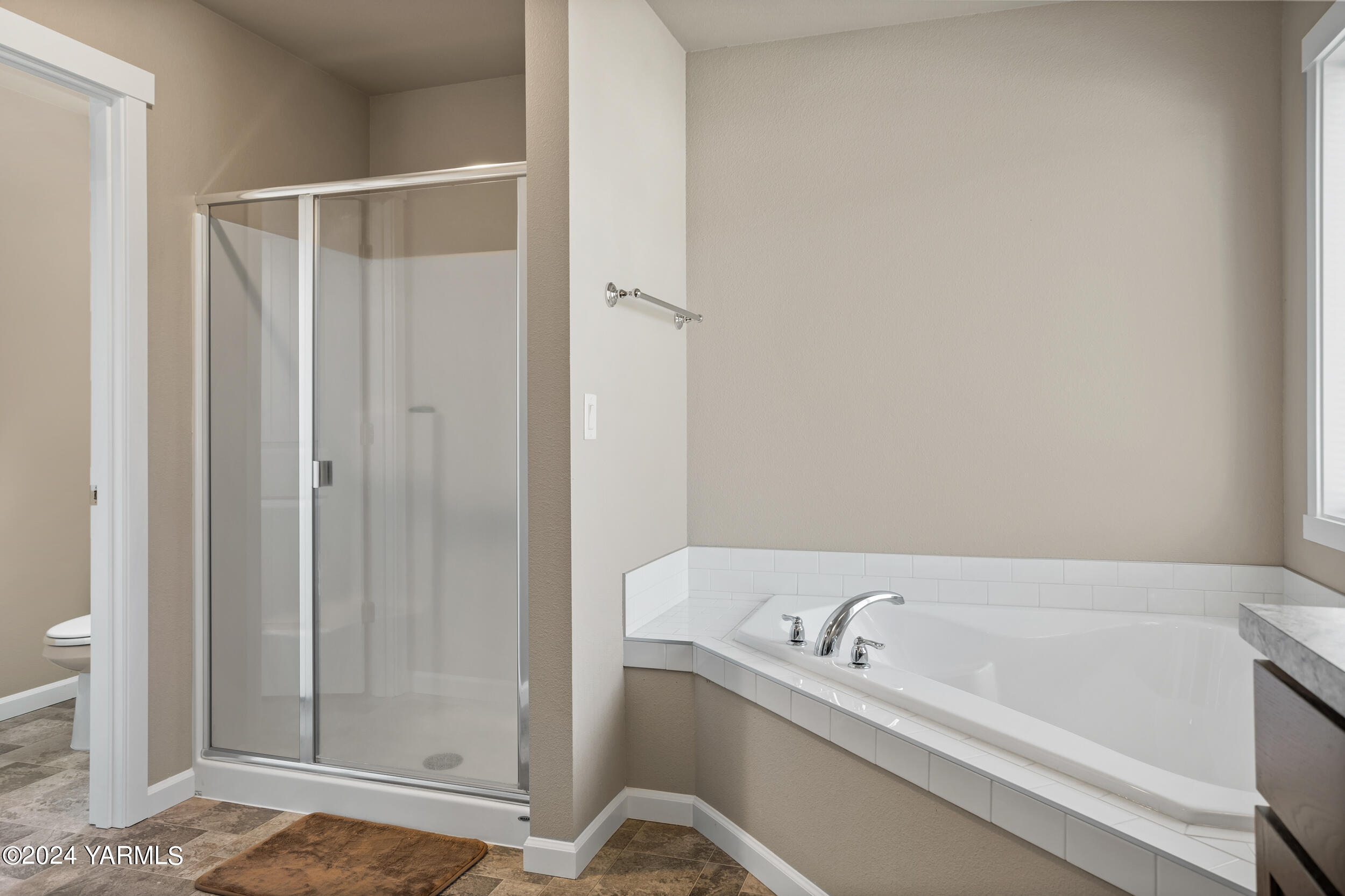 2100 Amber Loop Yakima, WA 98901 - Photo 16 of 25 a bathroom with a bathtub and shower