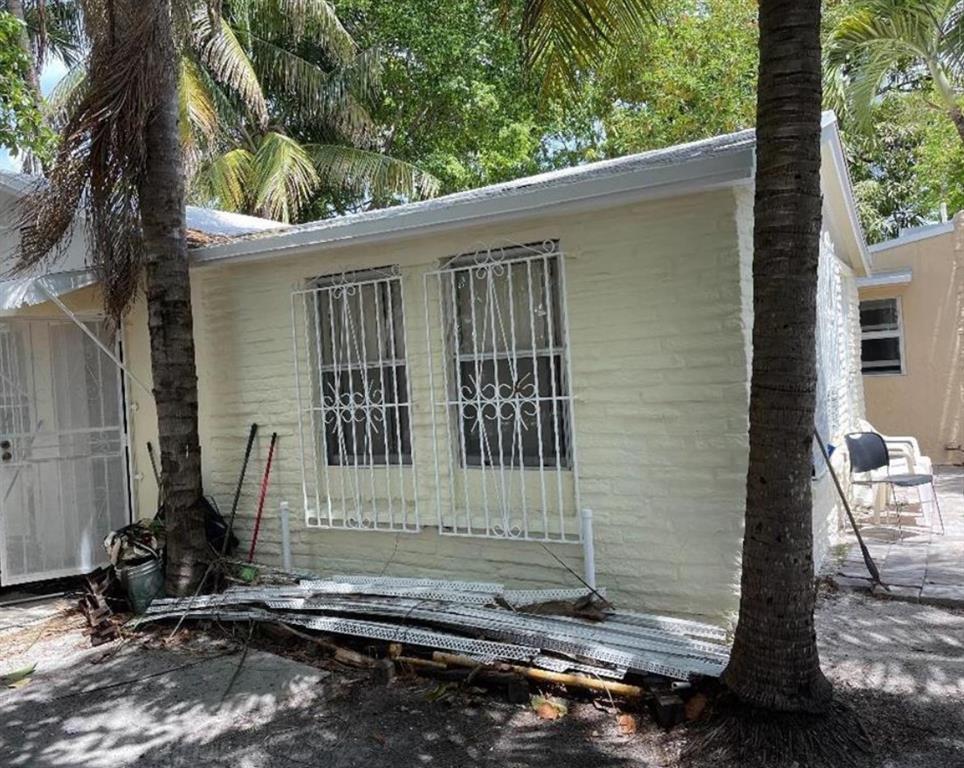 675 Northwest 34th Street Miami, FL 33127 - Photo 4 of 5 a front view of a house with a yard