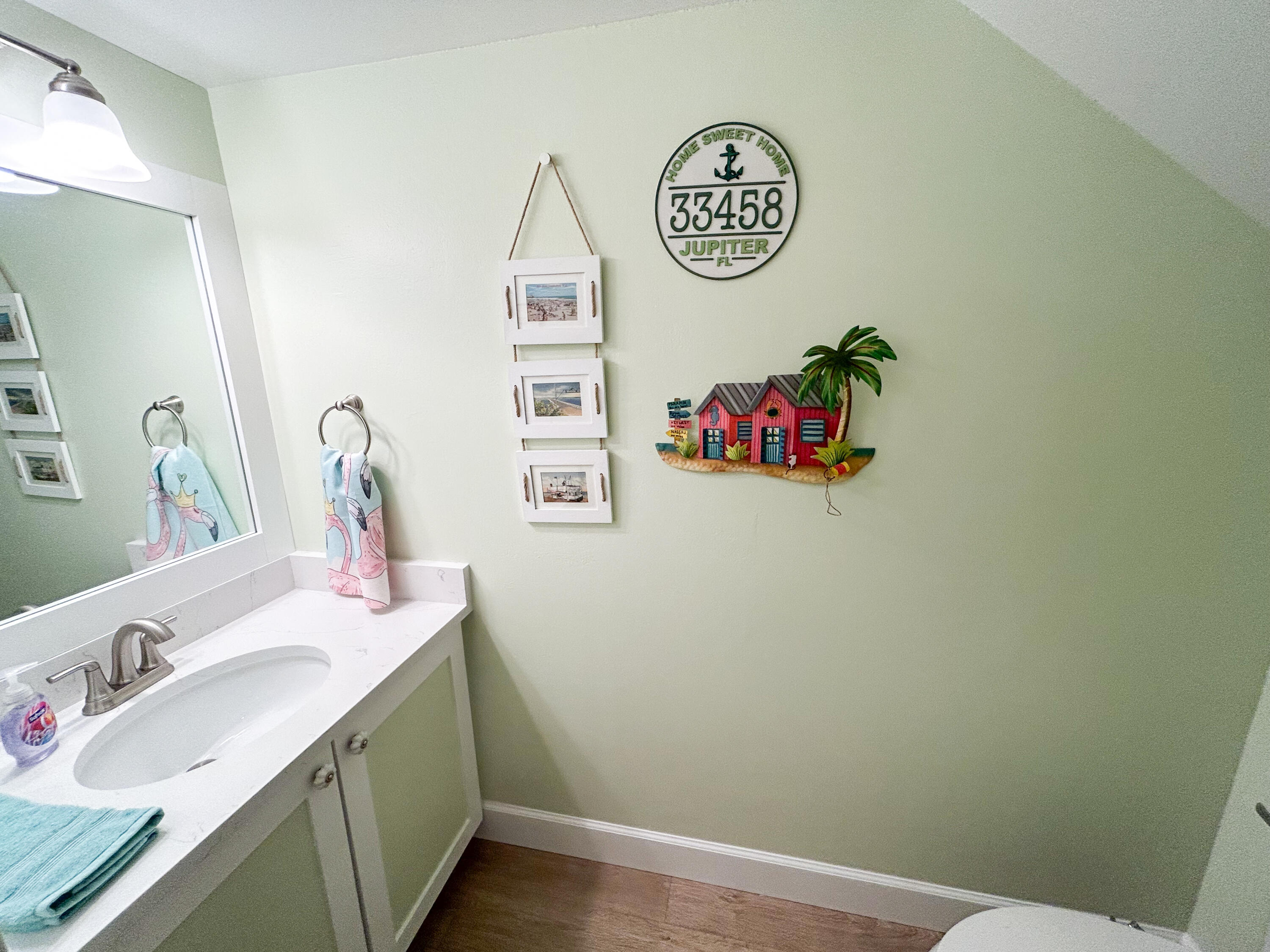 334 Timberwalk Trail Jupiter, FL 33458 - Photo 16 of 51 a bathroom with a sink and a mirror